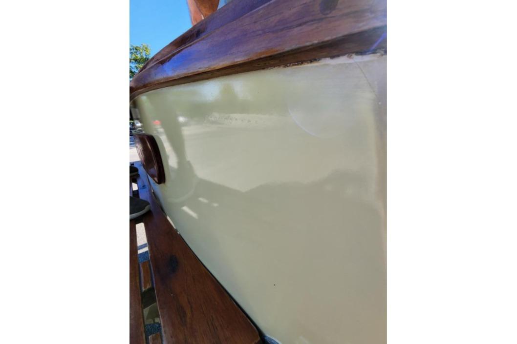 1985 Wasque Down East Cruiser boat with polished wooden trim and smooth hull.