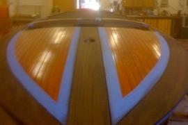 1931 Hacker-Craft 26 Dolphin boat with polished wooden deck.