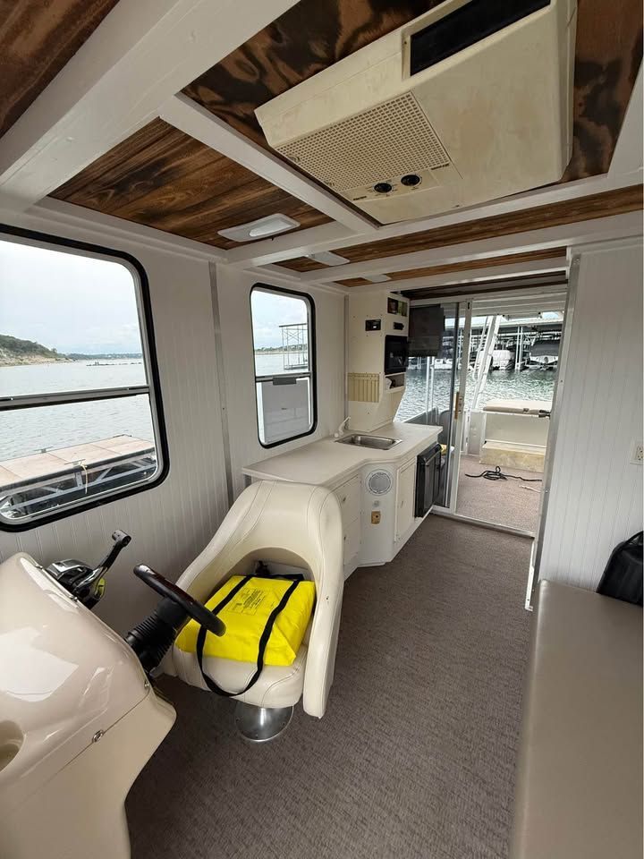 Interior of a 2008 Sun Tracker Party Cruiser on the water.