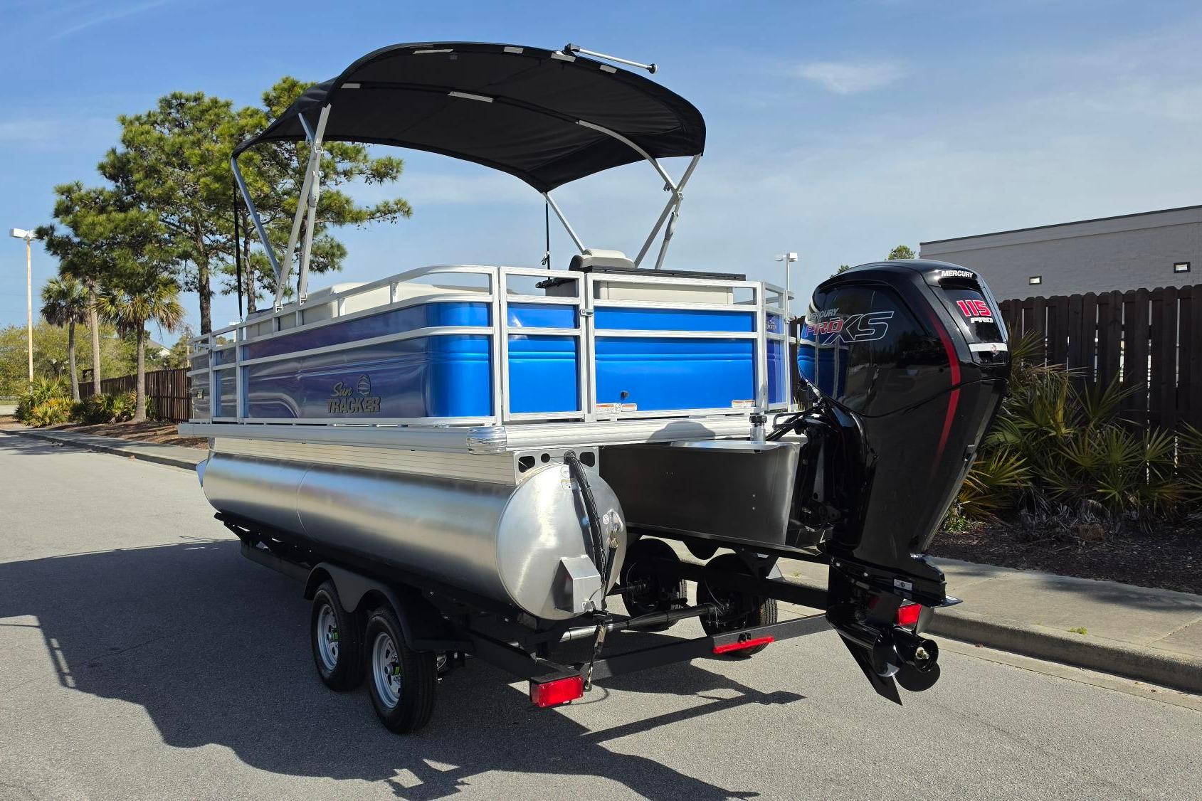 2026 Sun Tracker Fishin' Barge 20 DLX pontoon boat with Mercury 115 Pro XS engine.