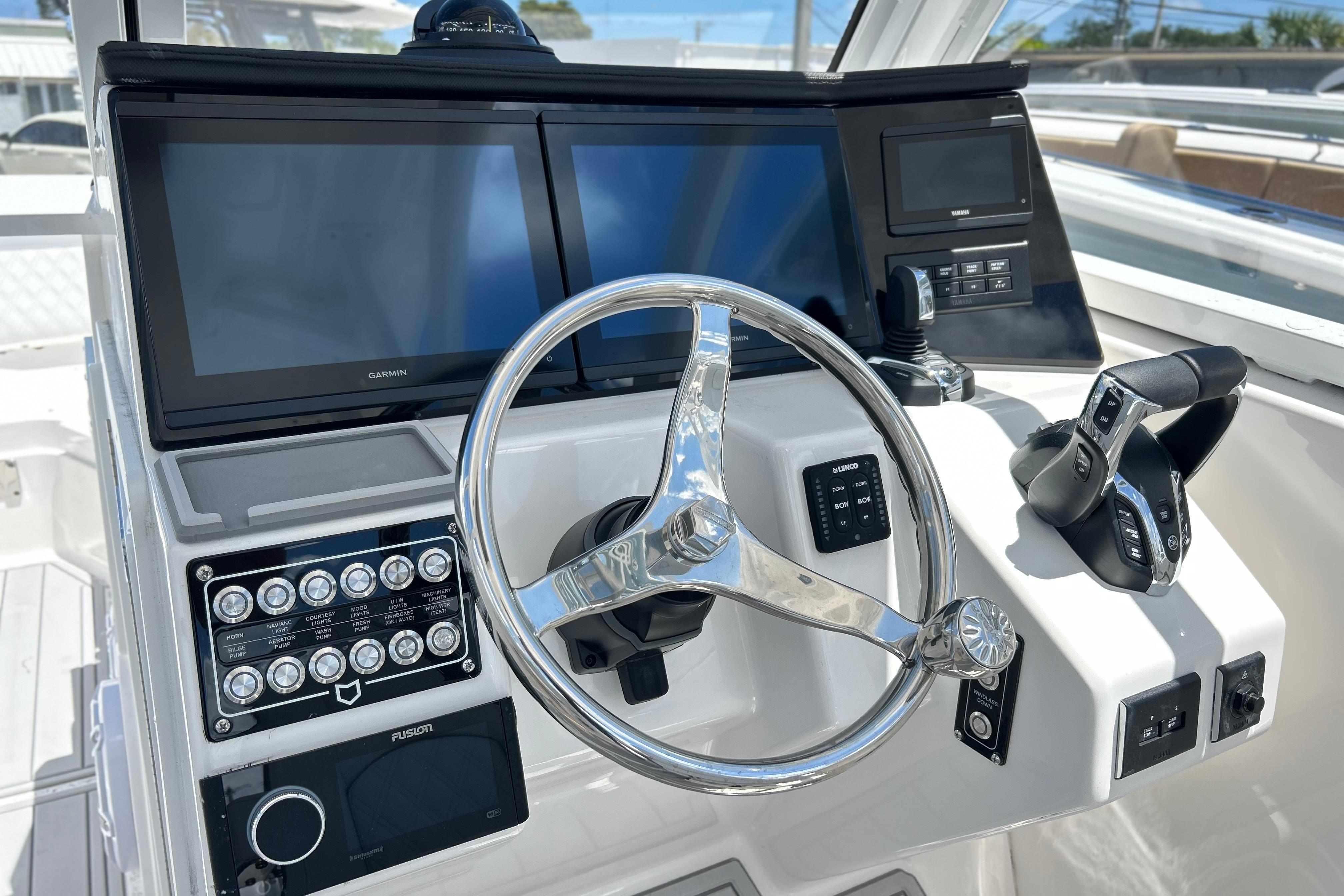 Helm of 2026 Sea Fox 288 Traveler with dual Garmin displays and modern controls.