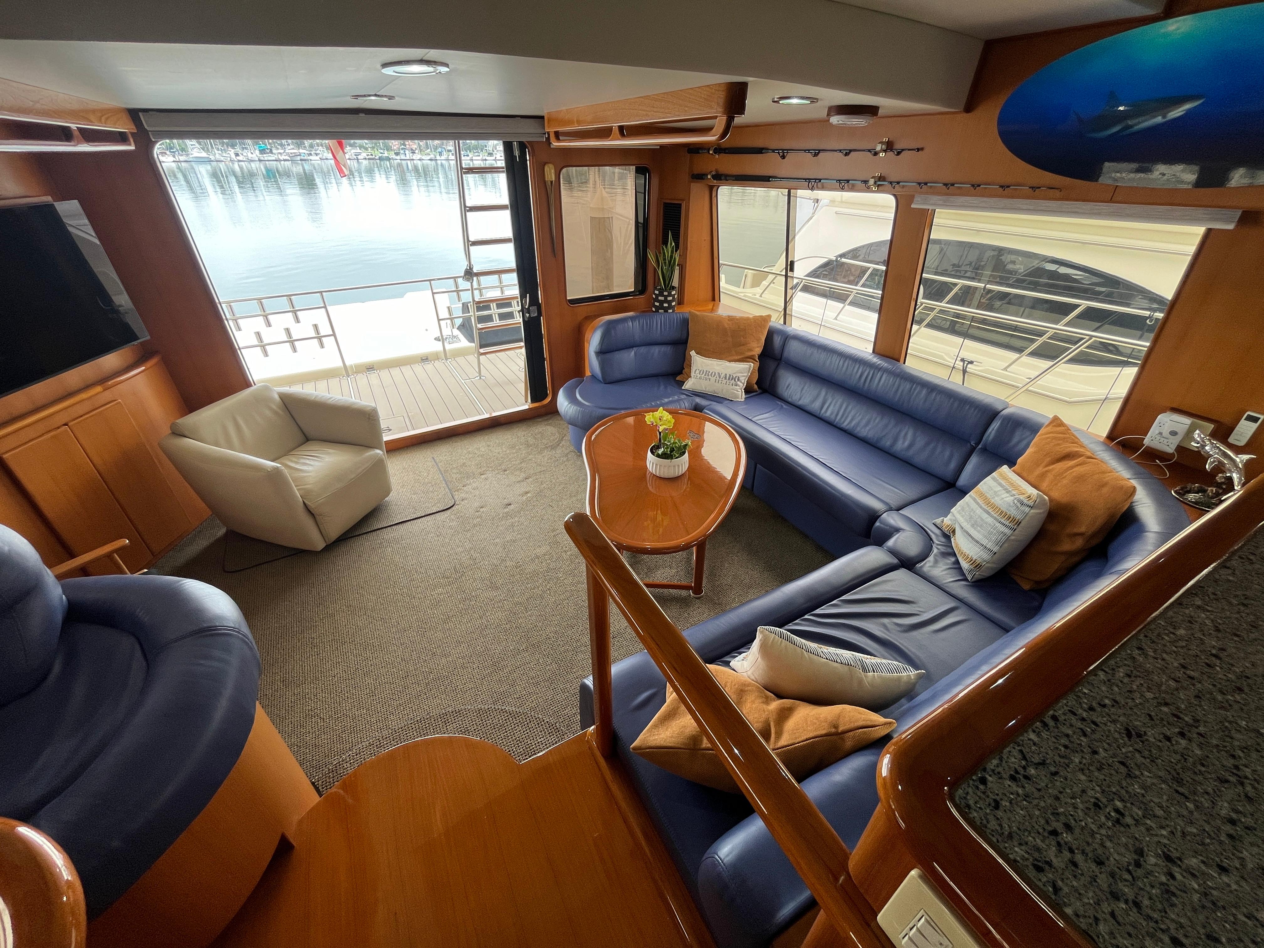 Luxurious interior of a 1999 Mikelson Long-Range Sportfisher with plush seating and elegant decor.
