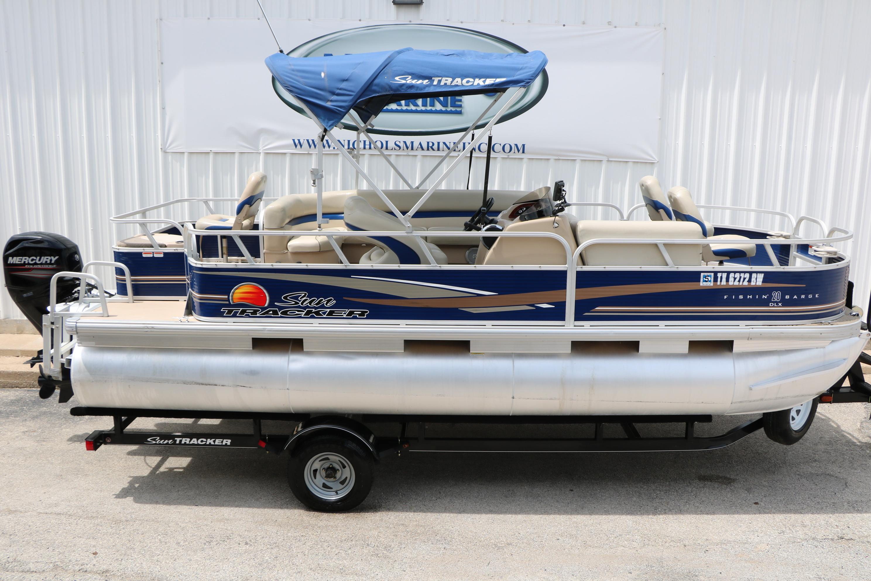 2013 Sun Tracker Fishin' Barge 20 DLX pontoon boat with canopy and trailer.