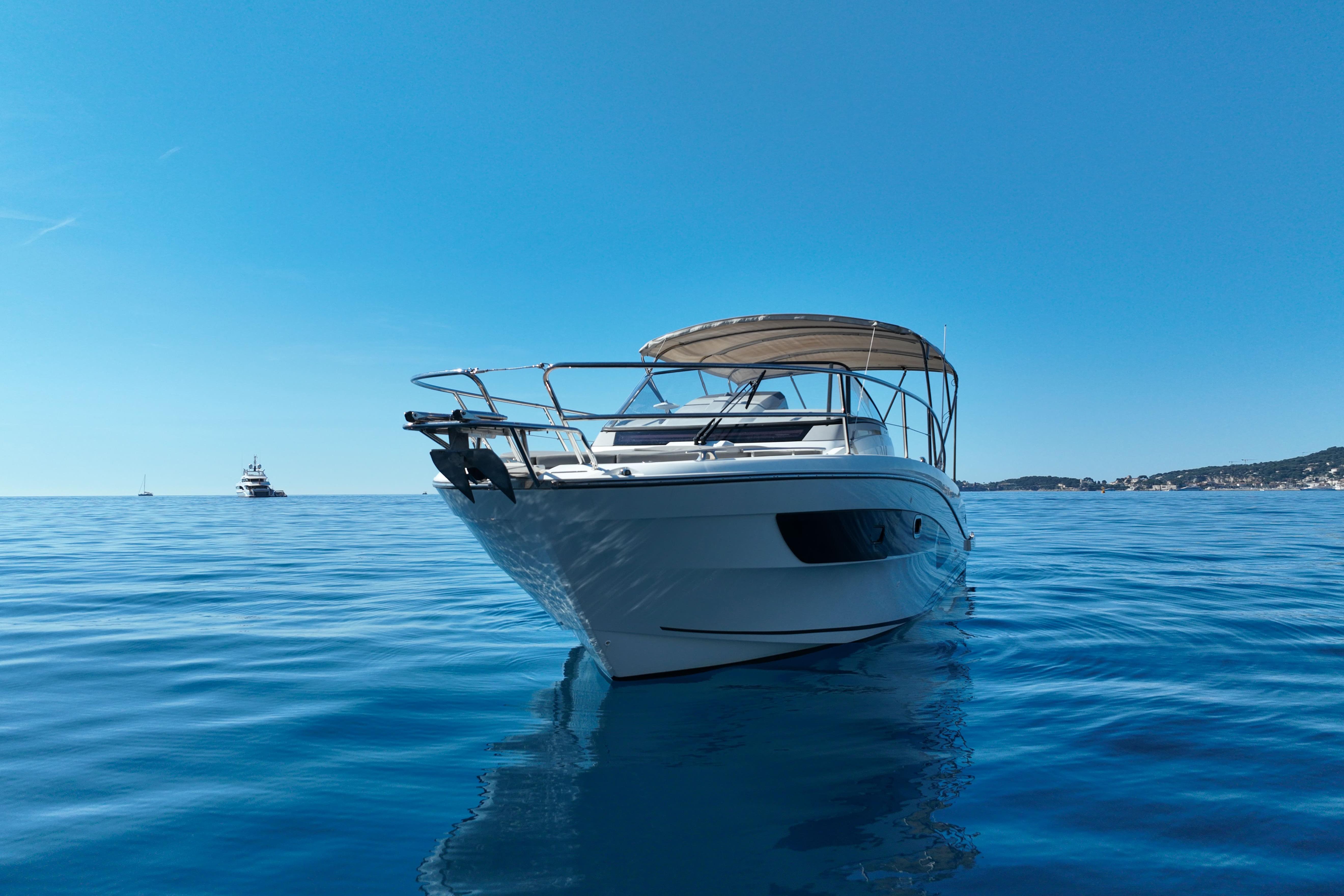 2018 Cap Camarat 10.5 WA boat on calm blue sea under clear sky.