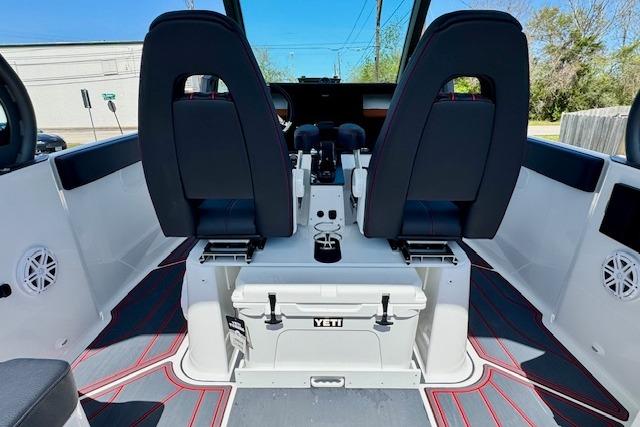 2026 Monterey Elite 25 OB boat interior with dual seats and Yeti cooler.