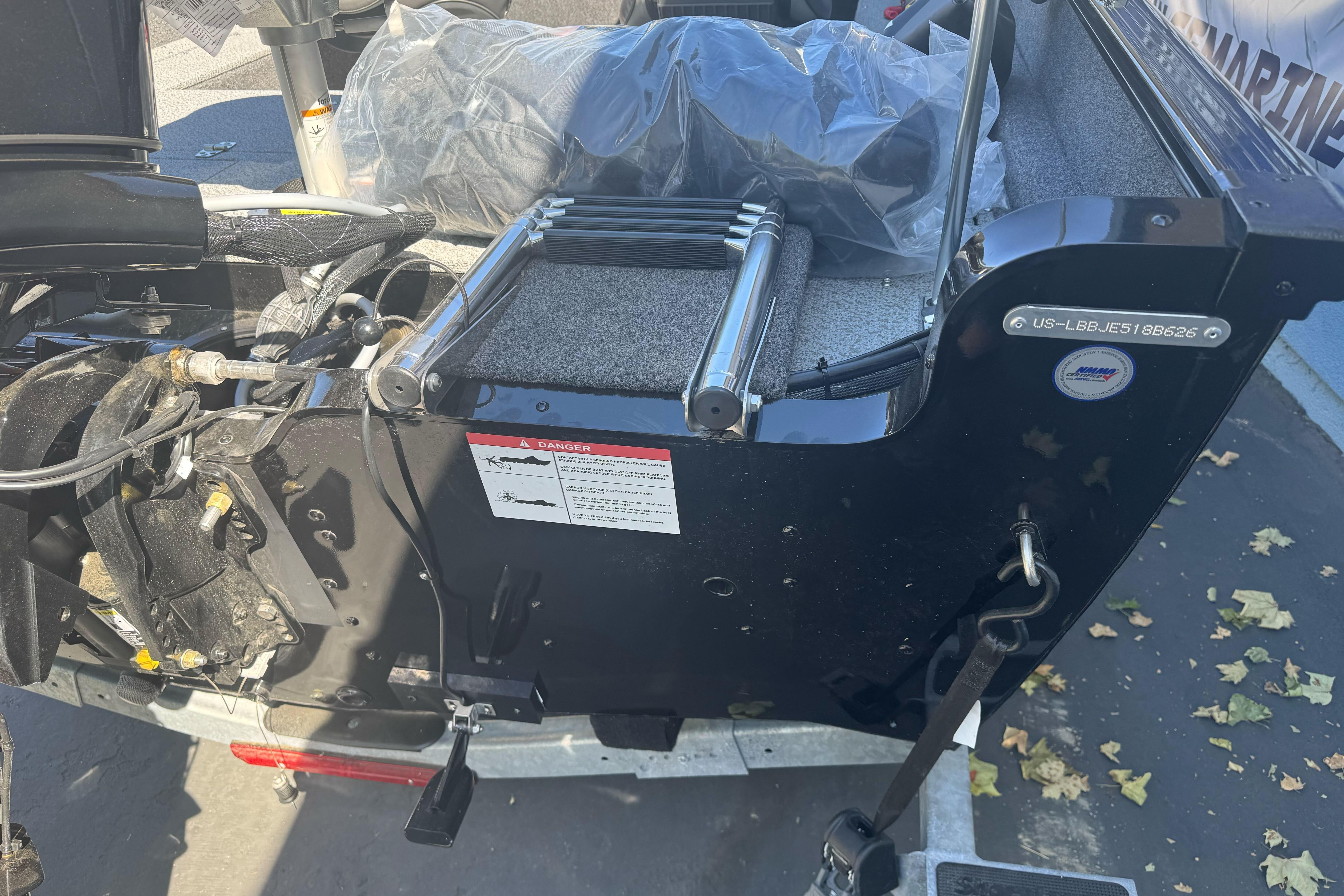 2026 Lund 1650 Rebel XL SS boat transom with motor and ladder details.