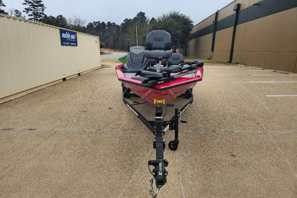 2026 Tracker Pro Team 175 Crappie Edition boat on trailer in parking lot.