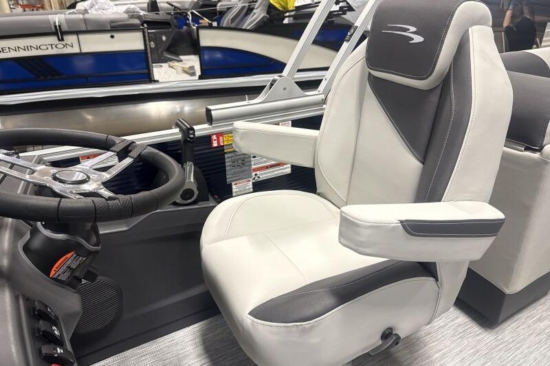 Captain's seat and steering wheel of 2026 Bennington 22 SSRSF boat.