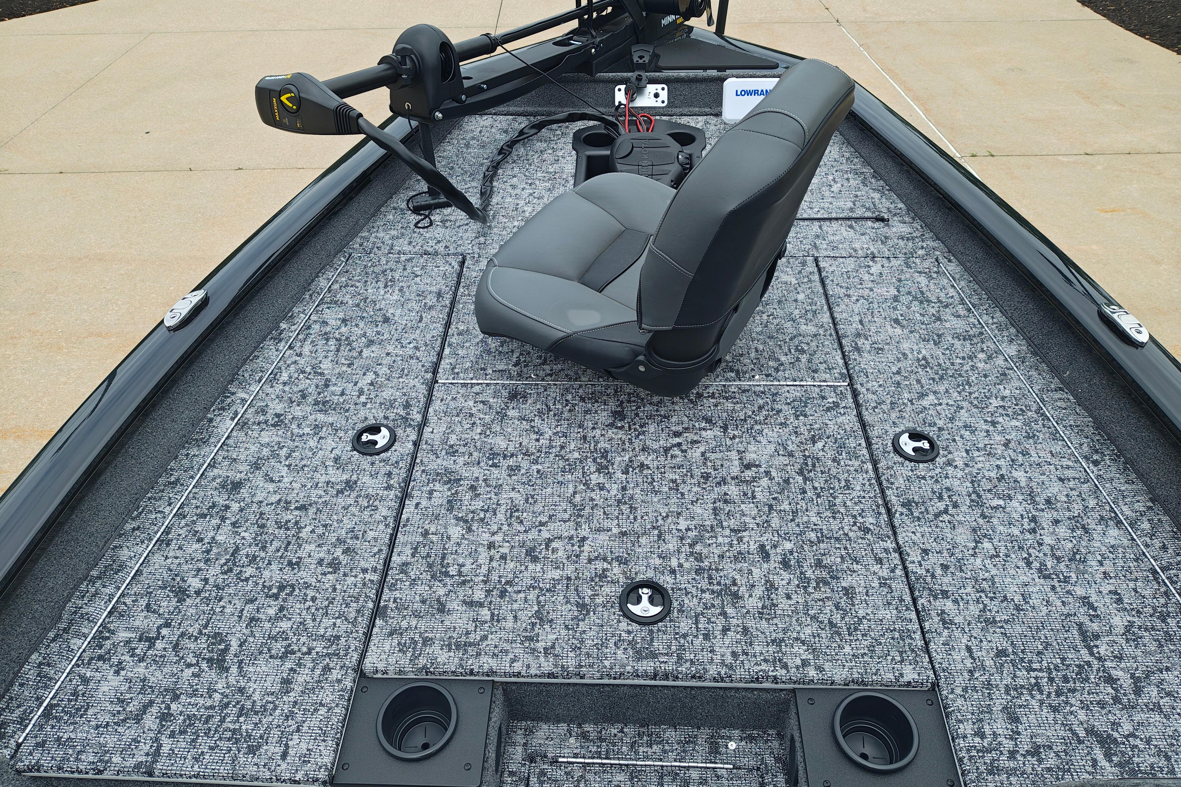 2026 Tracker Pro Team 175 boat interior with gray seating and carpeted deck.