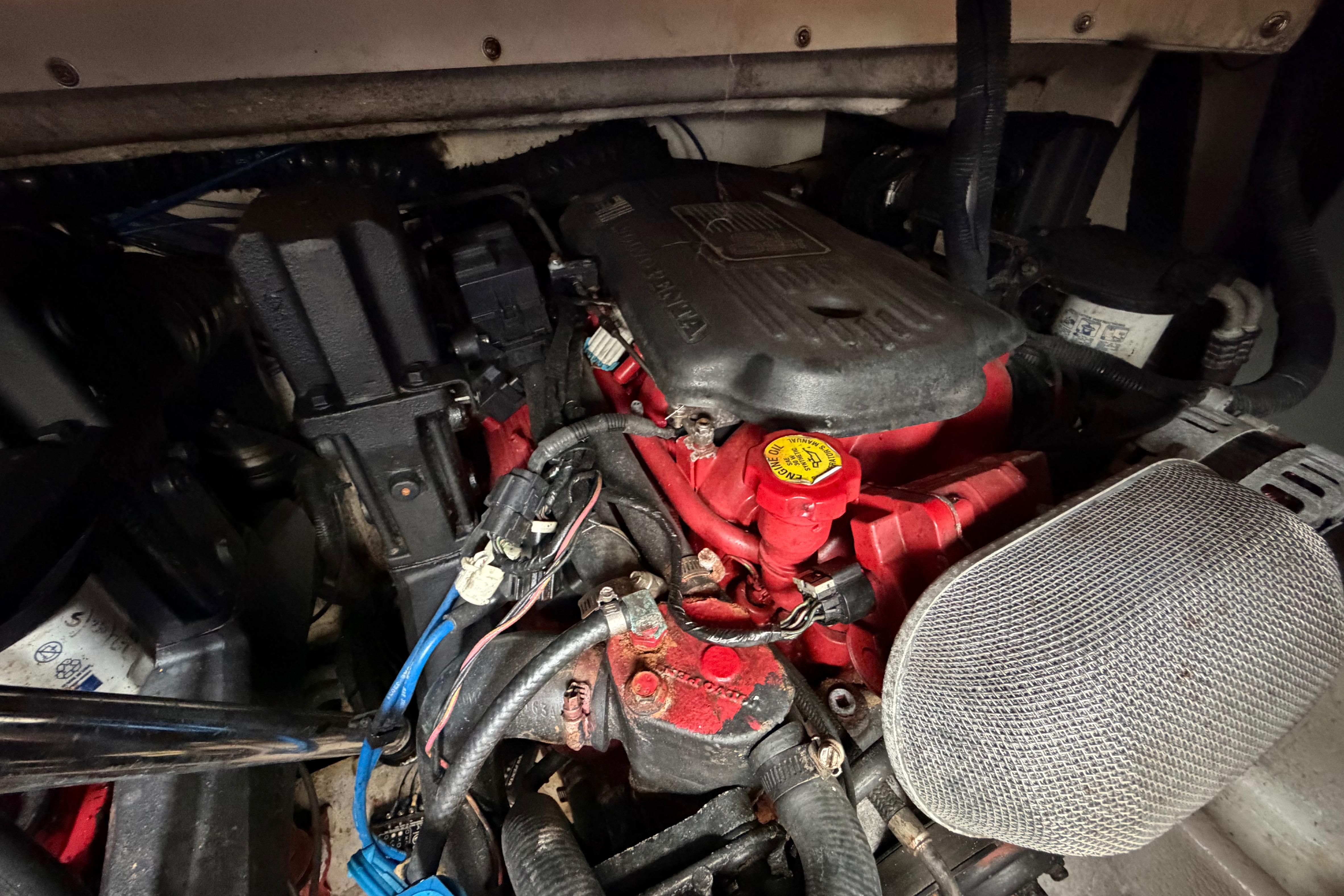 Engine compartment of a 2007 Monterey 350 Sport Yacht, showcasing mechanical components.