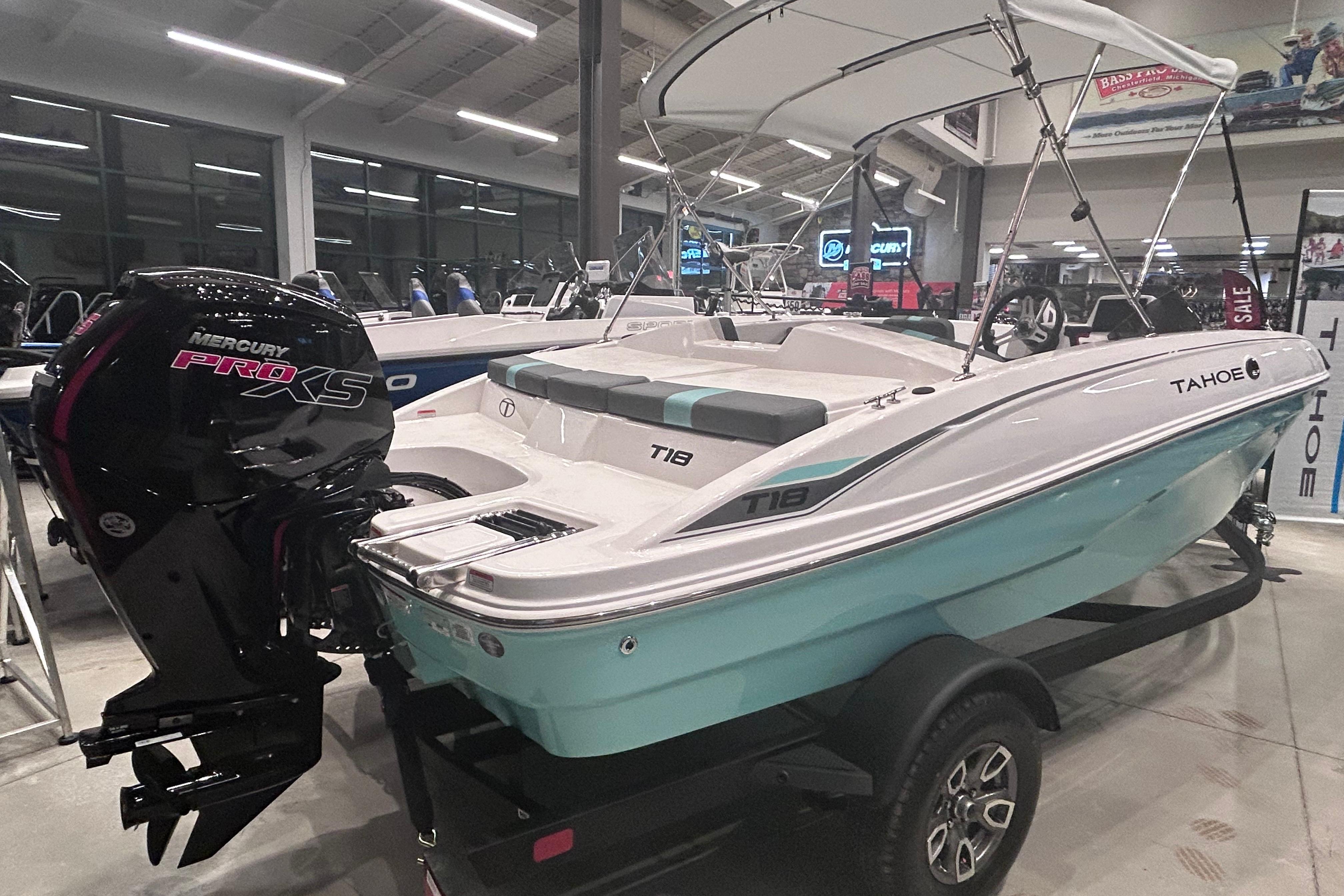 2026 Tahoe T18 boat with Mercury Pro XS engine in showroom display.