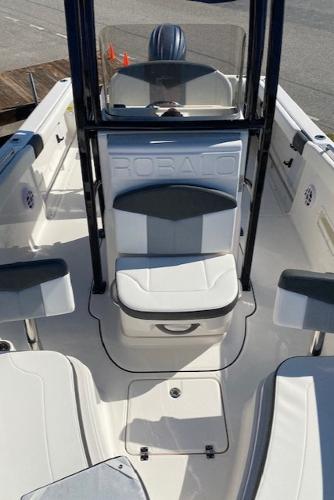 2024 Robalo R222 Center Console boat interior with seating and console.