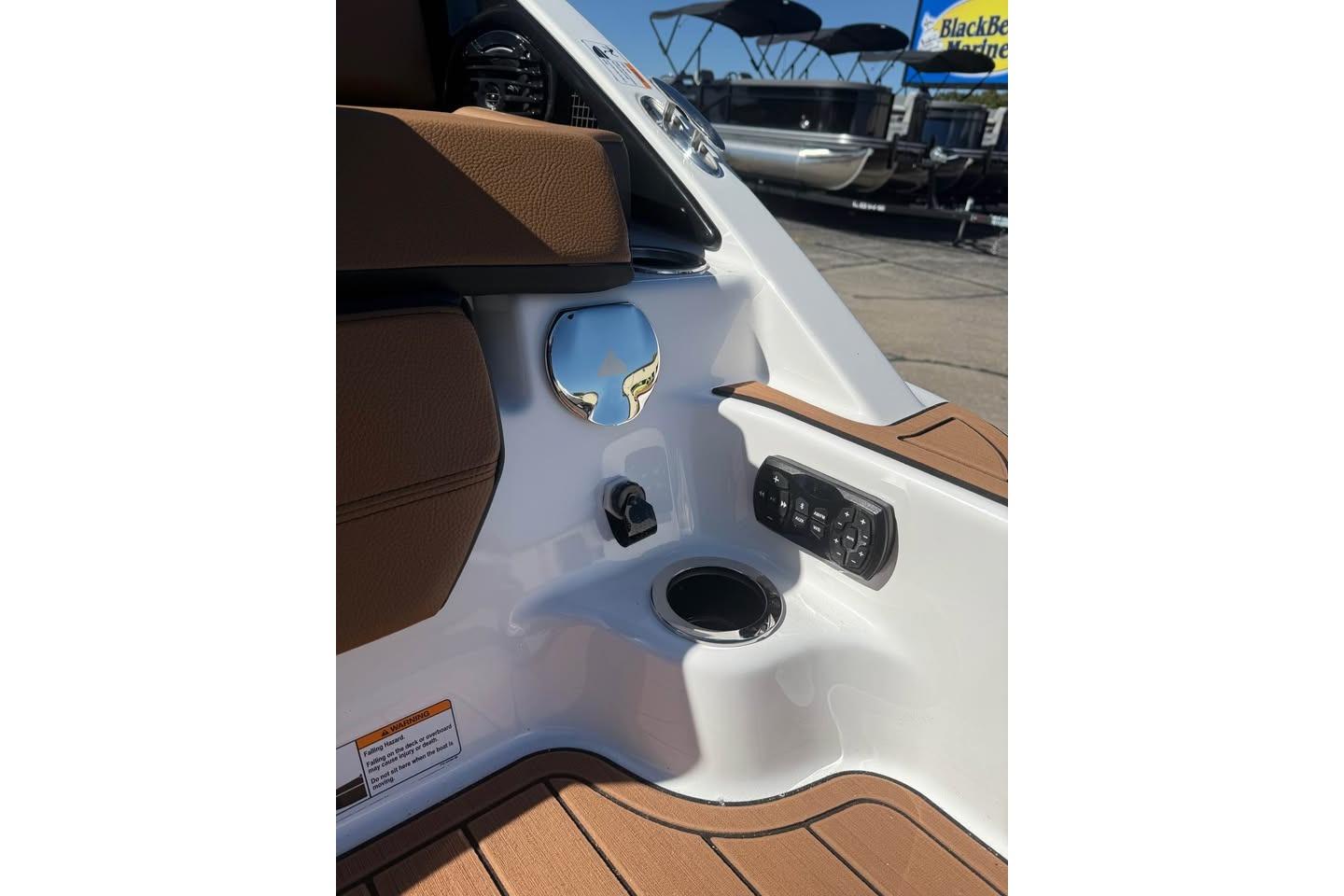 2026 Yamaha Boats 252SD interior detail with control panel and cup holder.