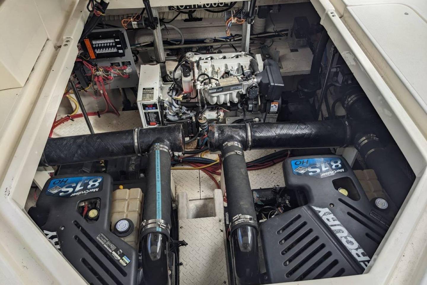 Engine compartment of a 2003 Cruisers 3970 boat with dual Mercury 8.1S motors.