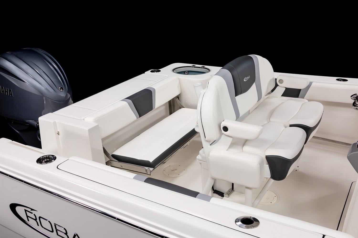 2025 Robalo R230 Center Console boat interior with seating and engine detail.