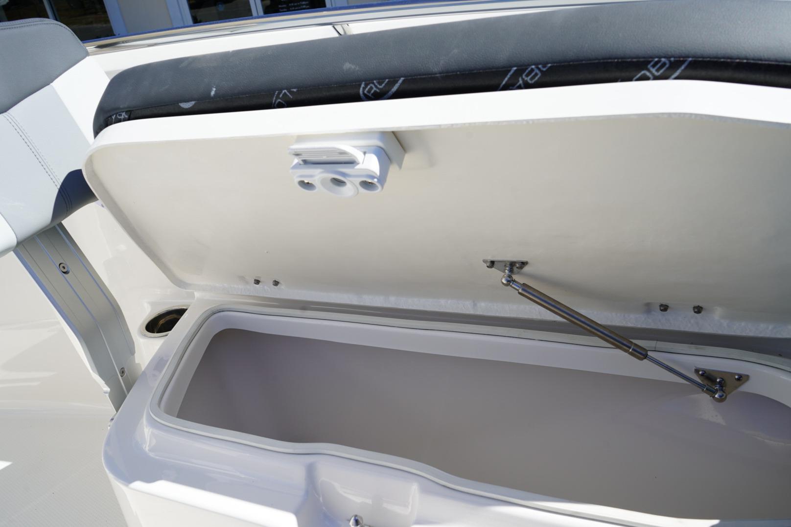 Open storage compartment on 2026 Robalo R202 Explorer boat.
