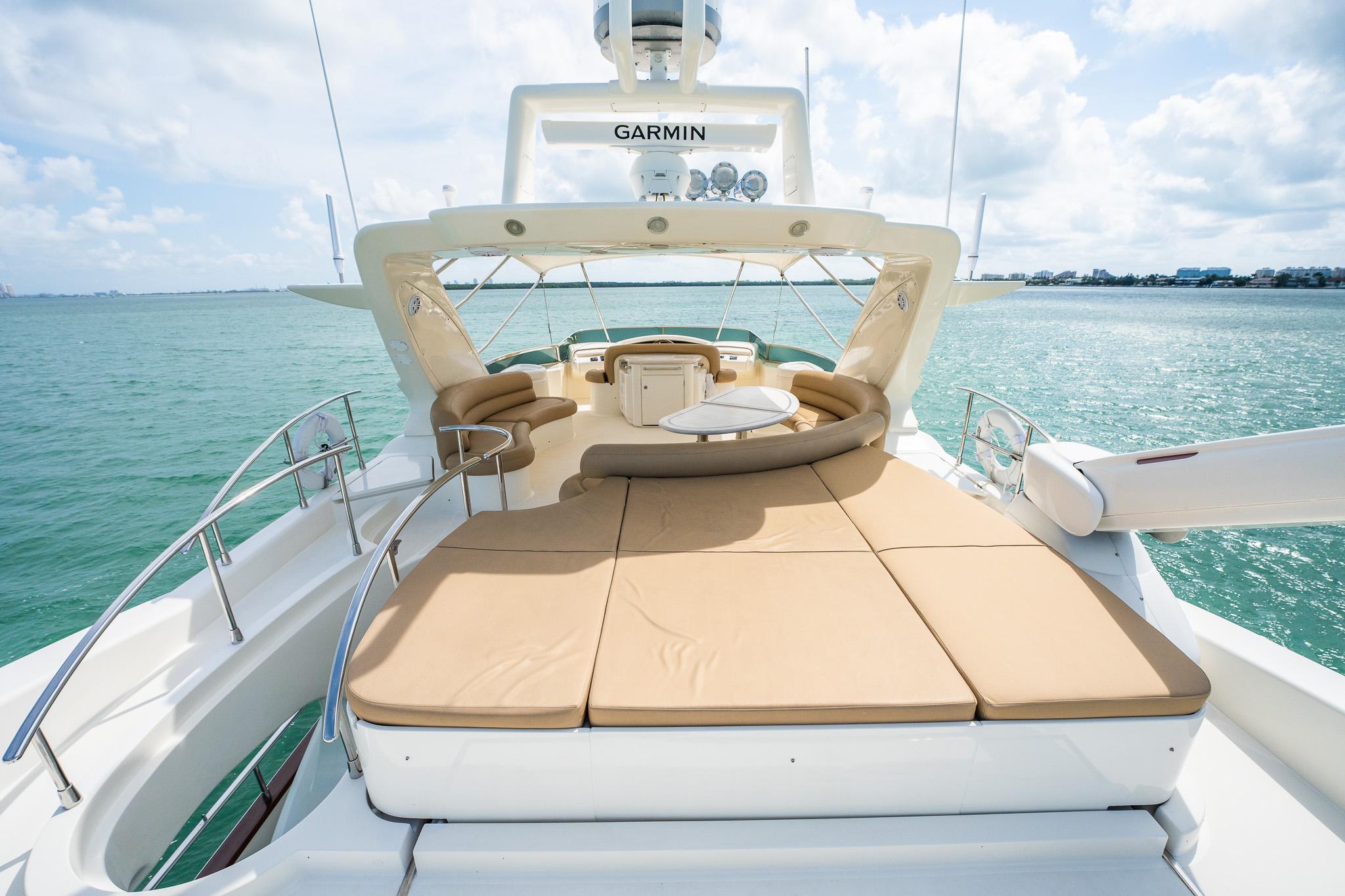 Luxurious 2004 Azimut 80 Carat yacht with spacious sun deck and ocean view.