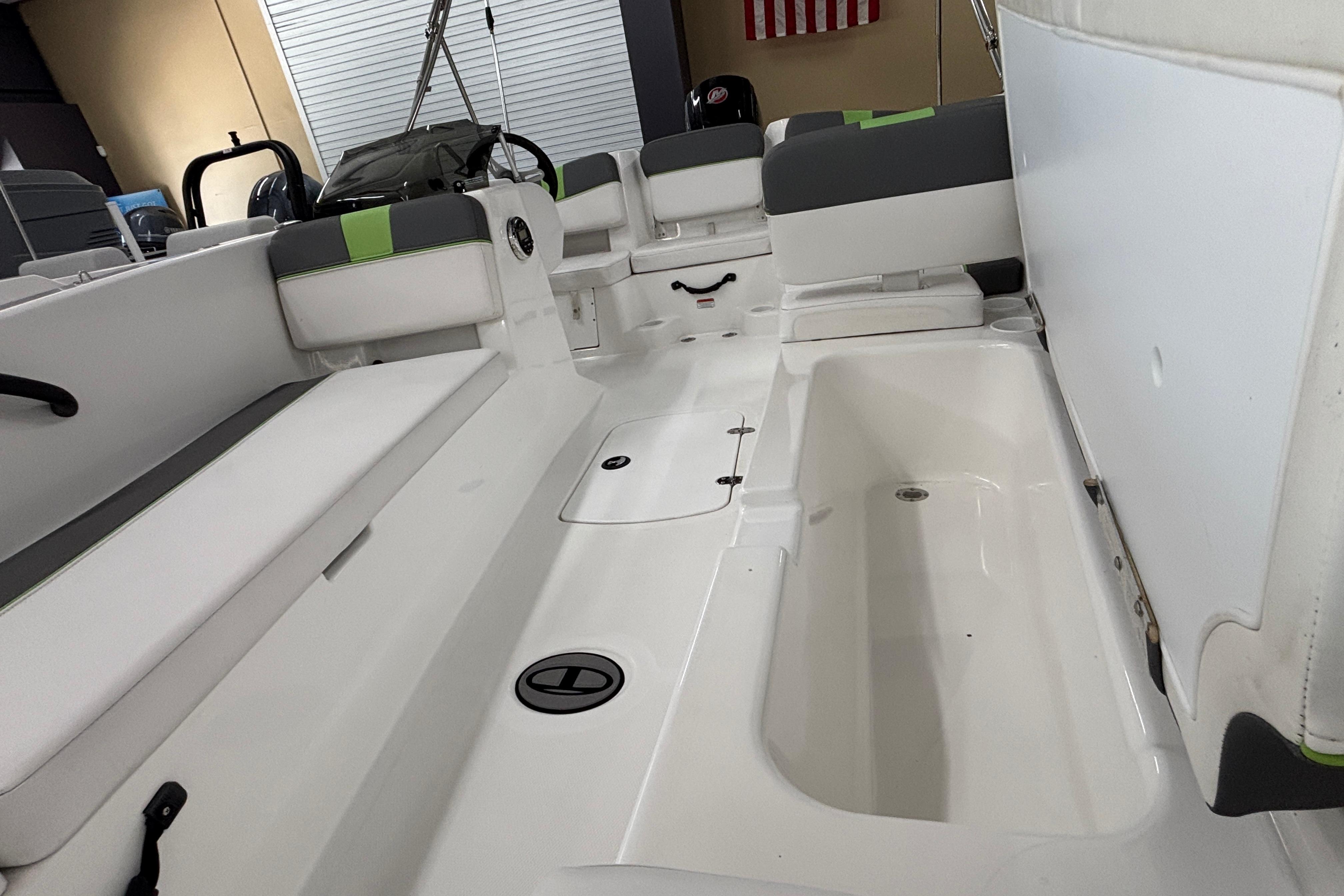 2024 Tahoe T18 boat interior with seating and storage compartments.