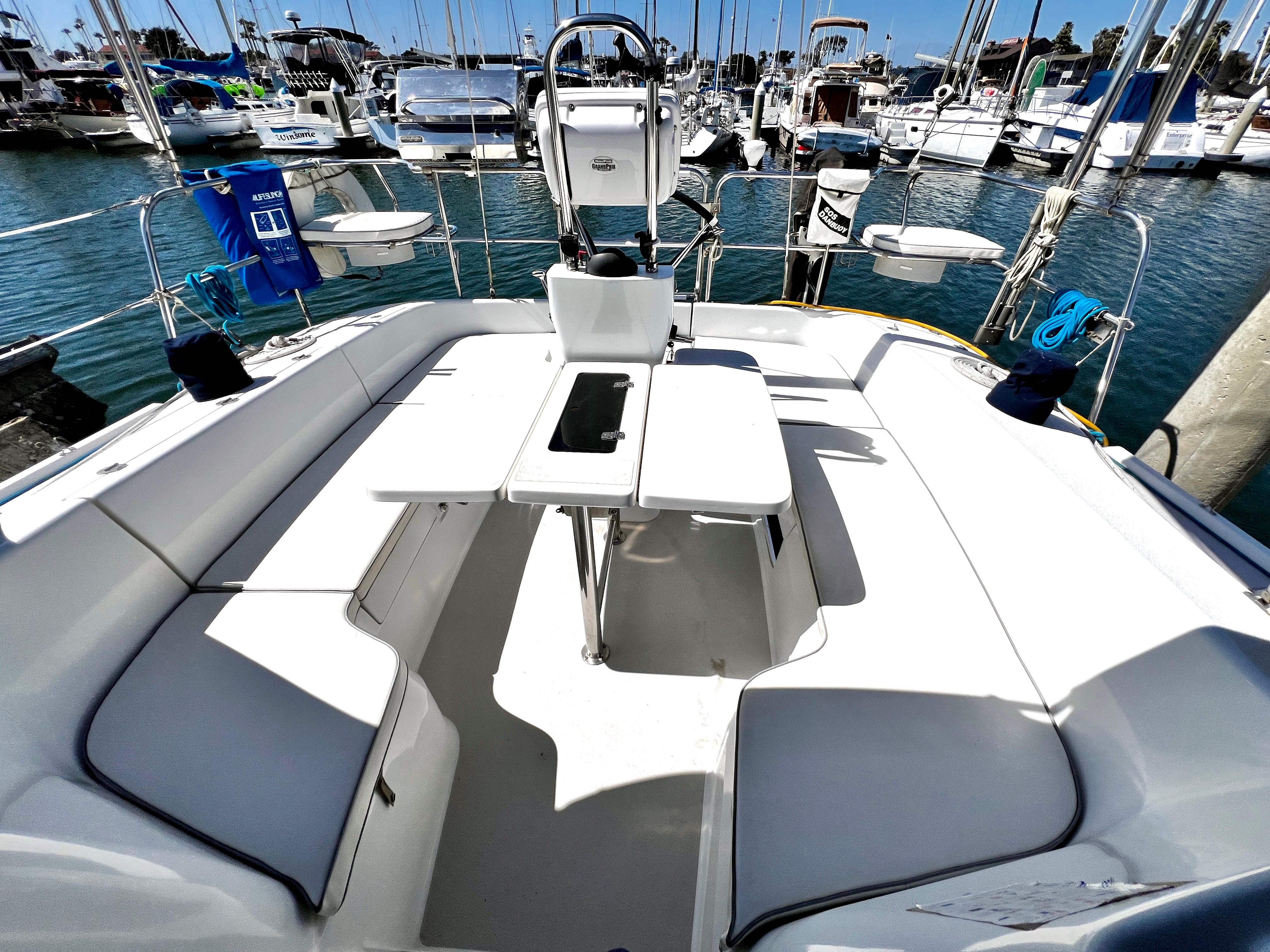 Spacious cockpit of a 2007 Catalina 350 sailboat docked at a marina.