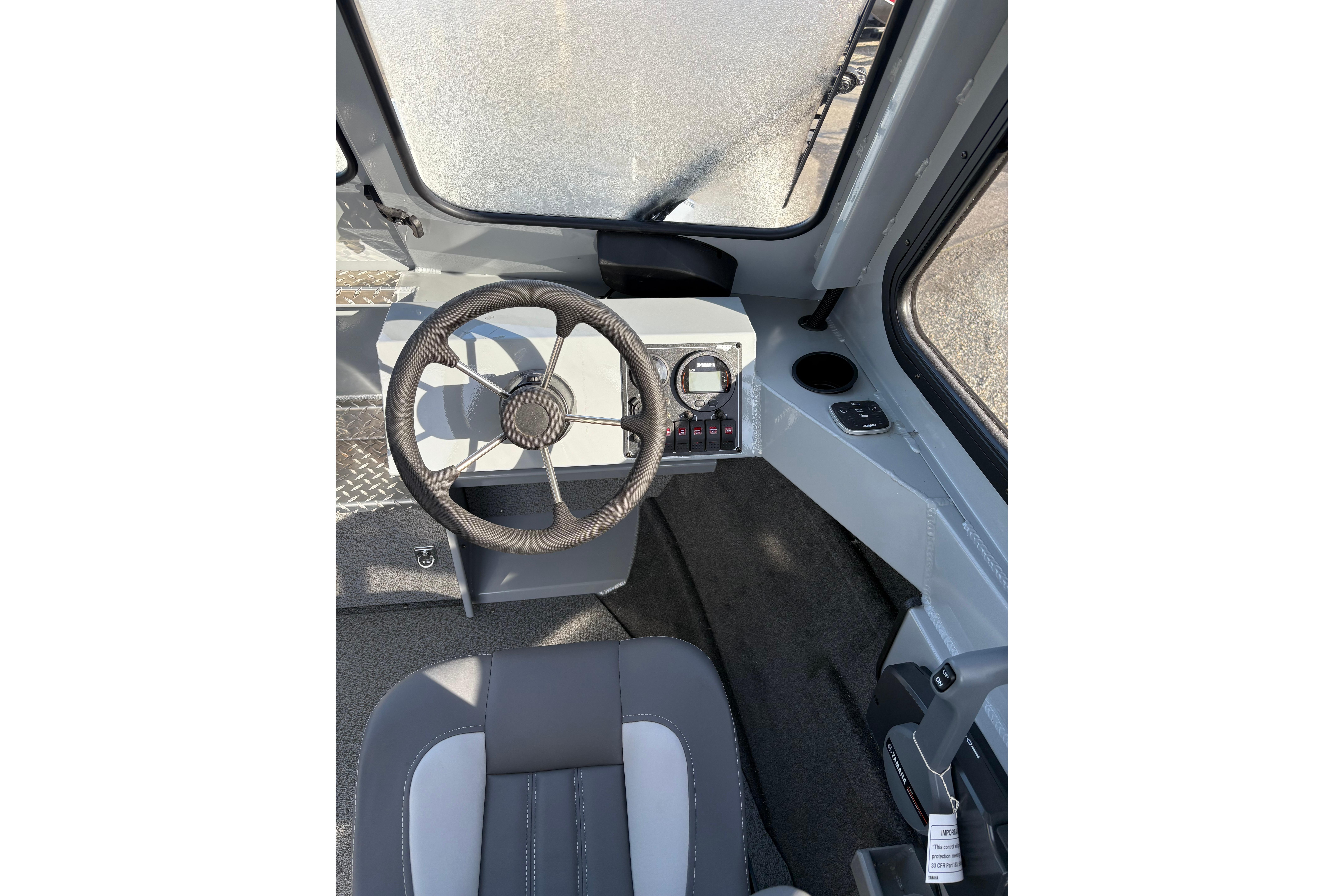 2026 Hewescraft 200 ProV ET HT boat interior with steering wheel and dashboard controls.