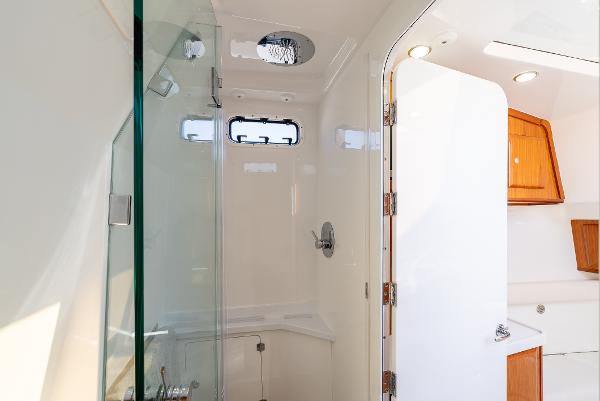Luxurious bathroom interior of 2020 HCB 53 Sueños yacht with glass shower.