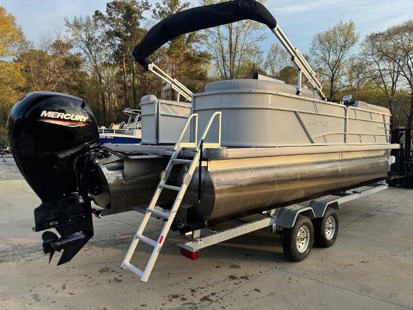 2022 Godfrey 2286 pontoon boat on trailer with Mercury outboard motor.