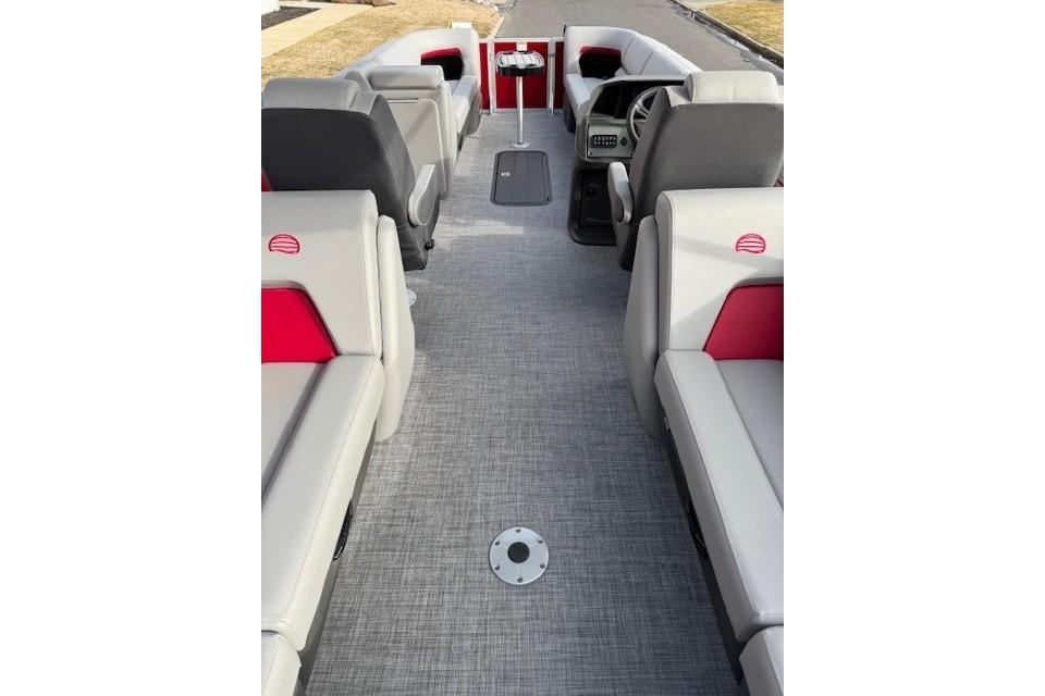 2026 Sun Tracker Party Barge 24 XP3 interior with gray and red seating.