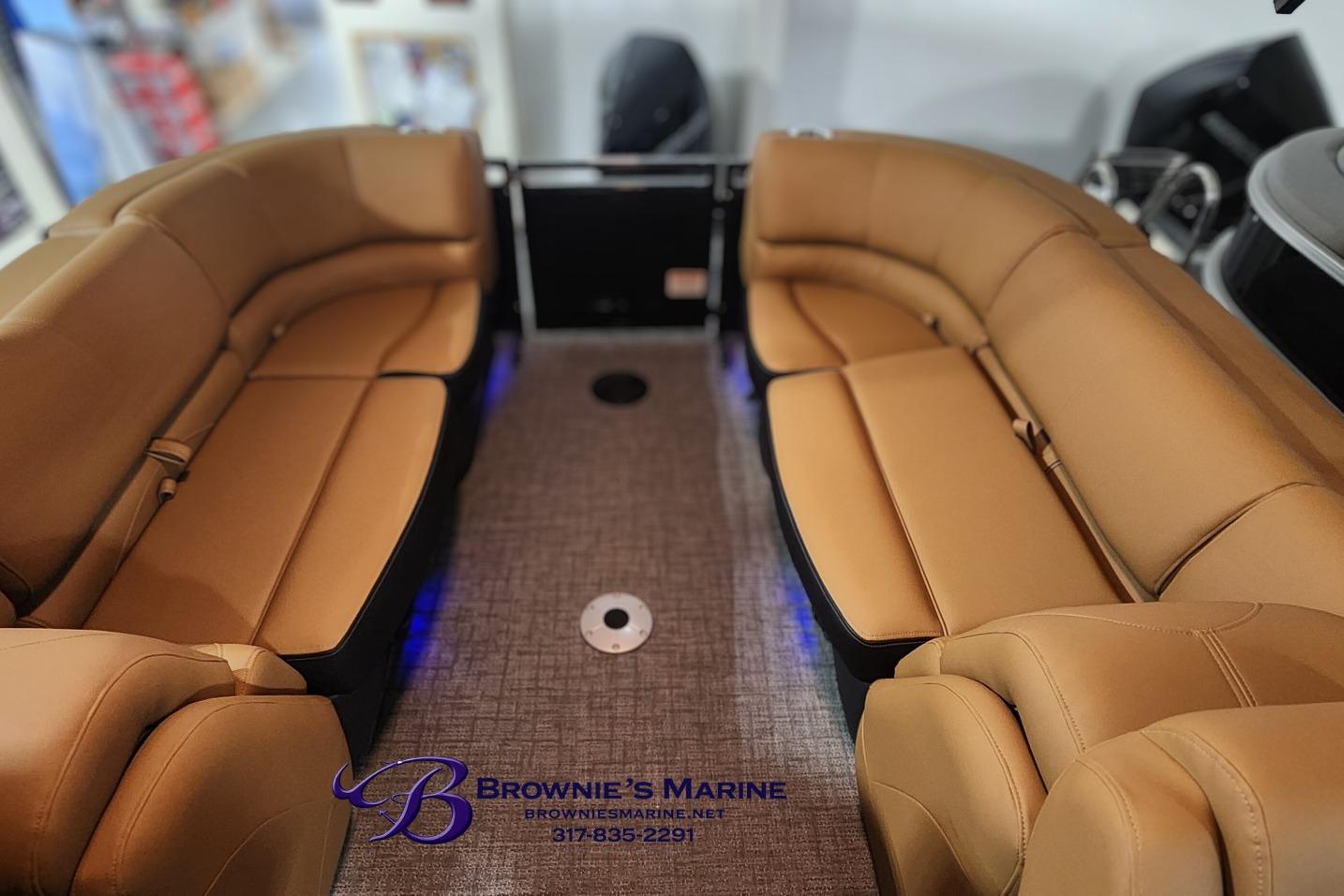 Luxurious interior of 2026 Regency 250 DL boat with tan leather seating.
