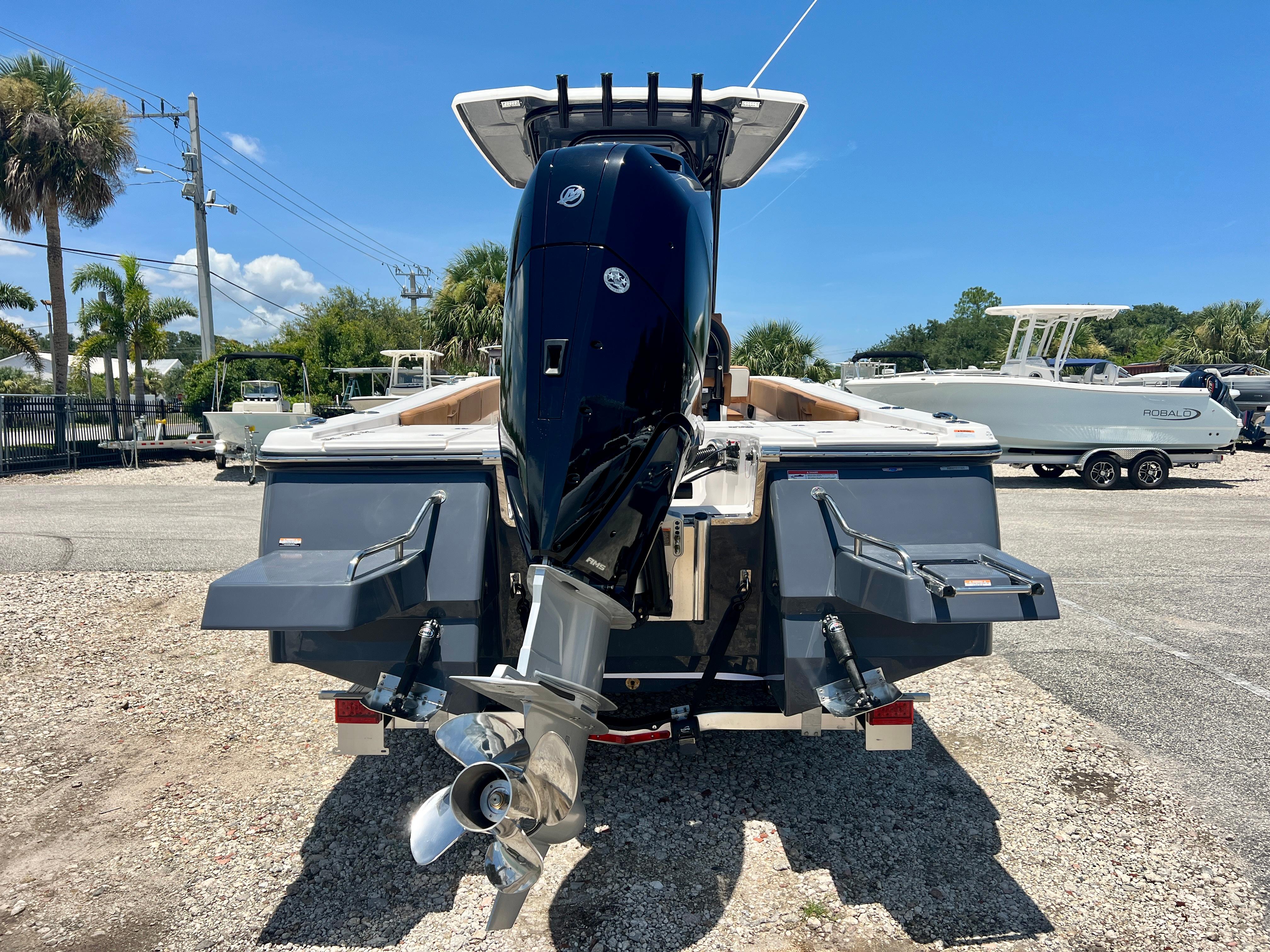 2025 Robalo 266 Cayman with outboard motor, parked outdoors.