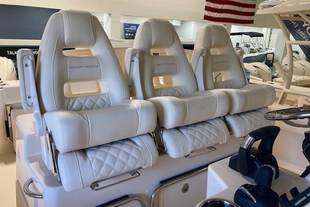 Luxurious seating on 2026 Grady-White Canyon 336 boat, featuring plush white upholstery.