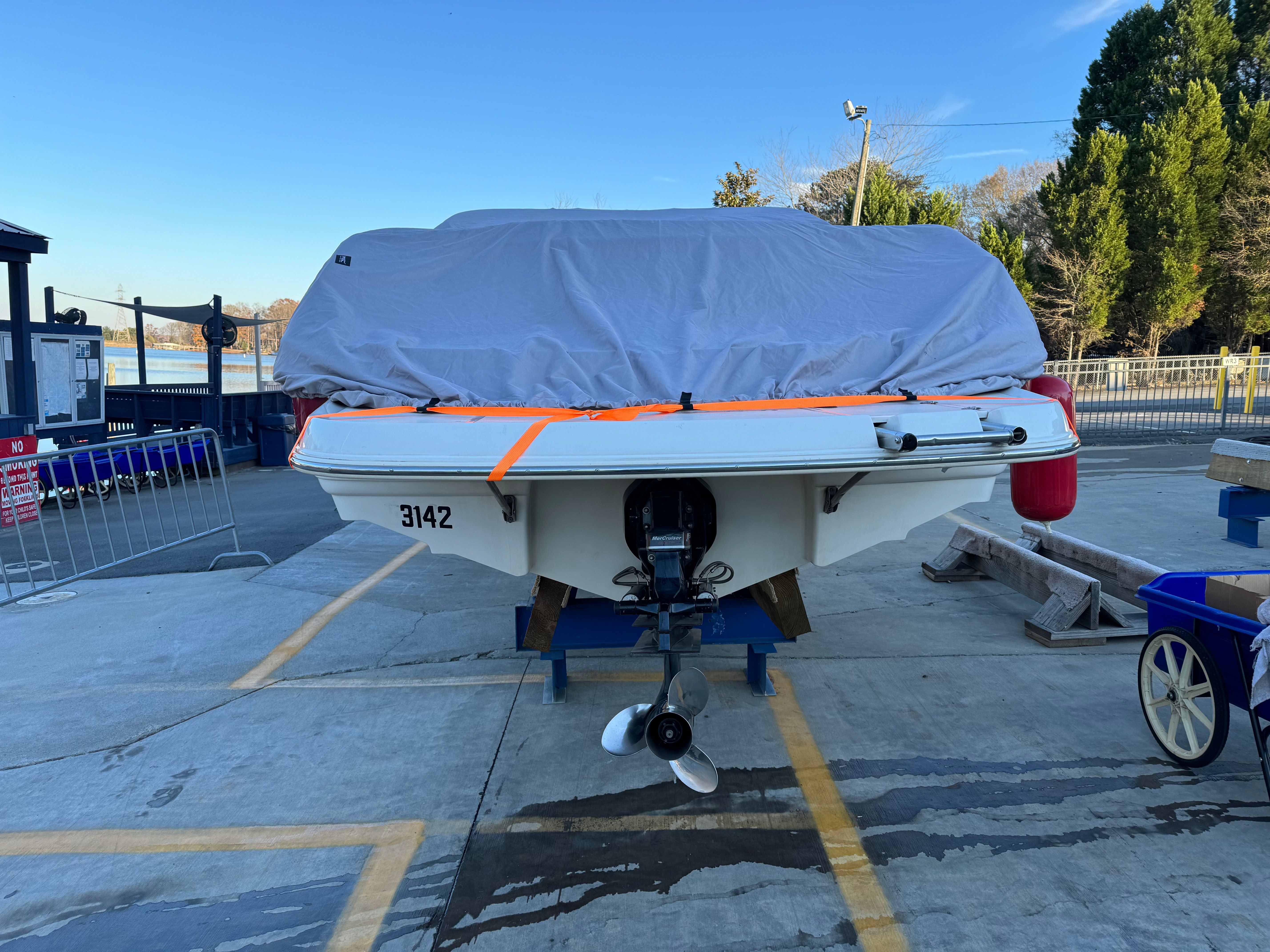 2000 Chaparral 230 SSi boat covered and on a trailer.