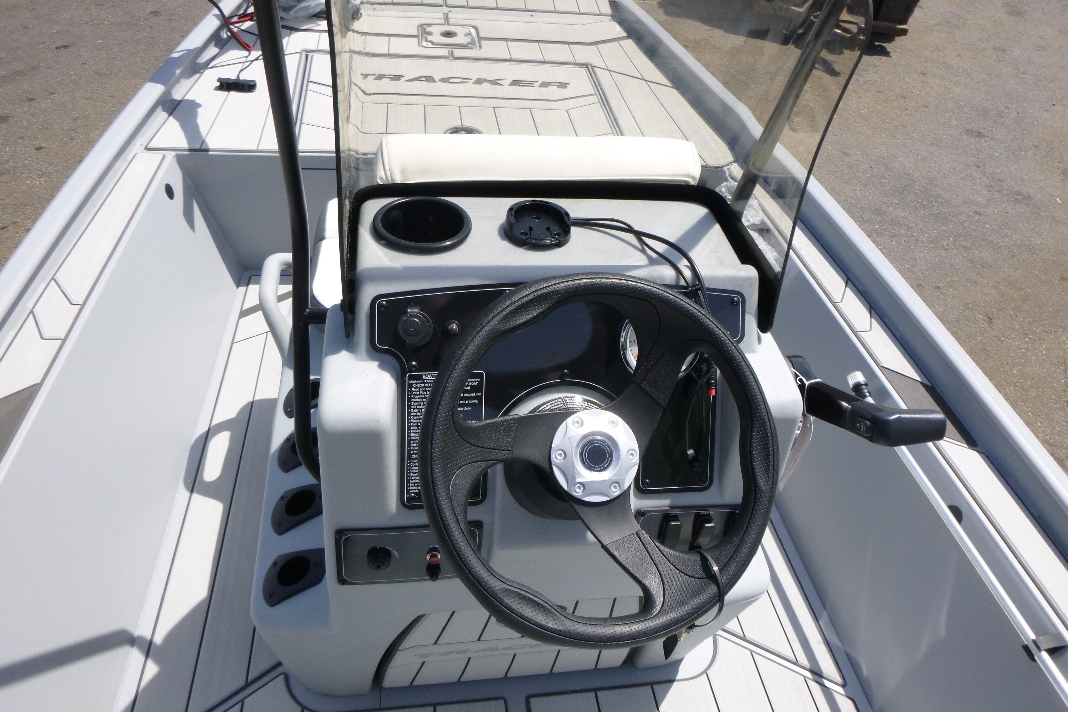 2026 Tracker Bass Tracker Classic CC boat console with steering wheel and controls.