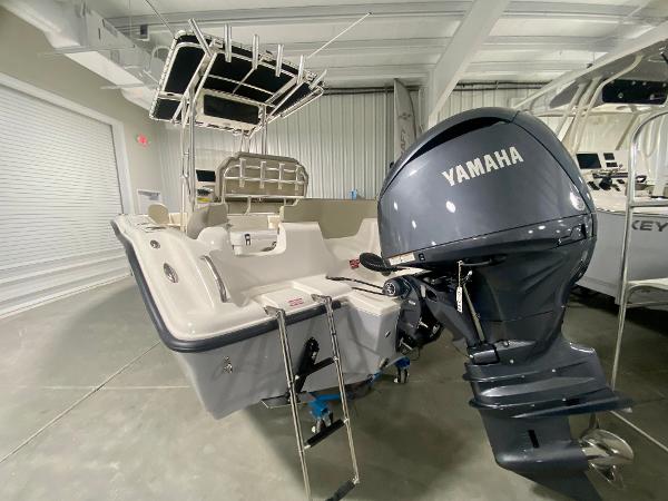 2024 Key West 219 FS boat with Yamaha outboard motor in showroom.