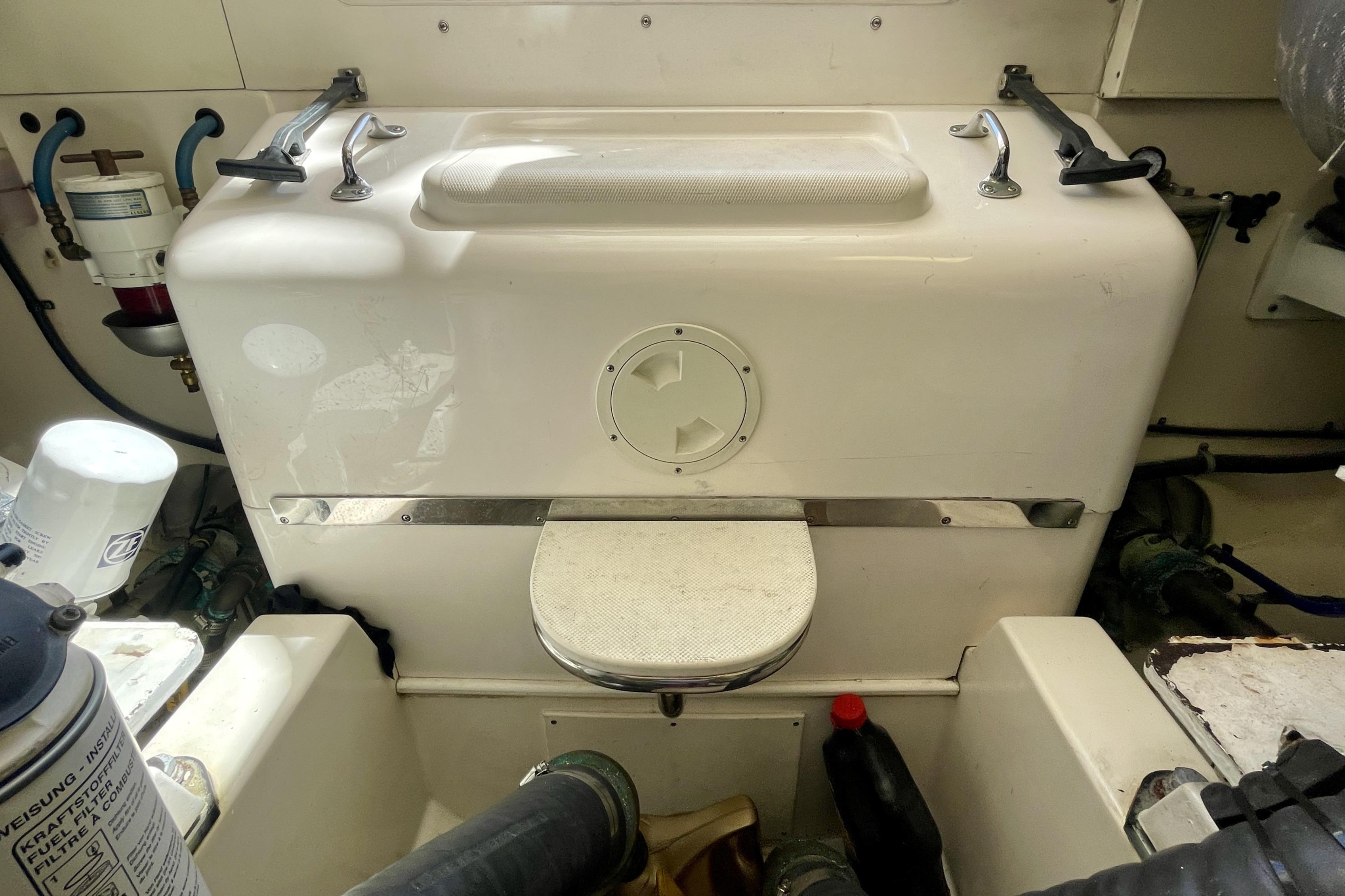 Engine compartment of a 2006 Cabo 40 Flybridge boat, showcasing mechanical components.