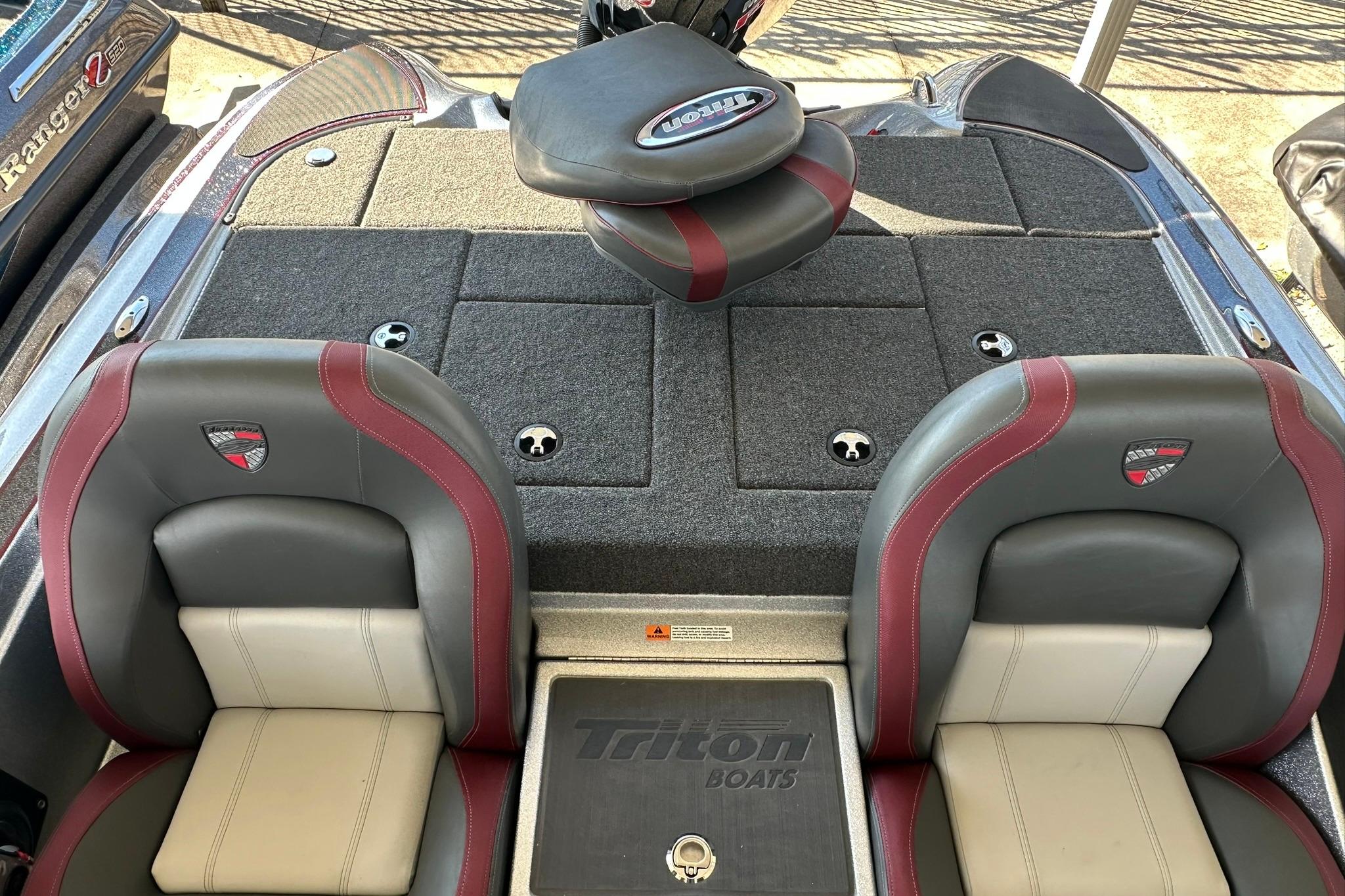 2026 Triton 179 TrX boat interior with dual seats and carpeted deck.