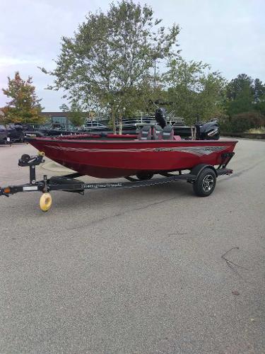 2024 Ranger VS1665T boat on trailer in parking lot, red color.