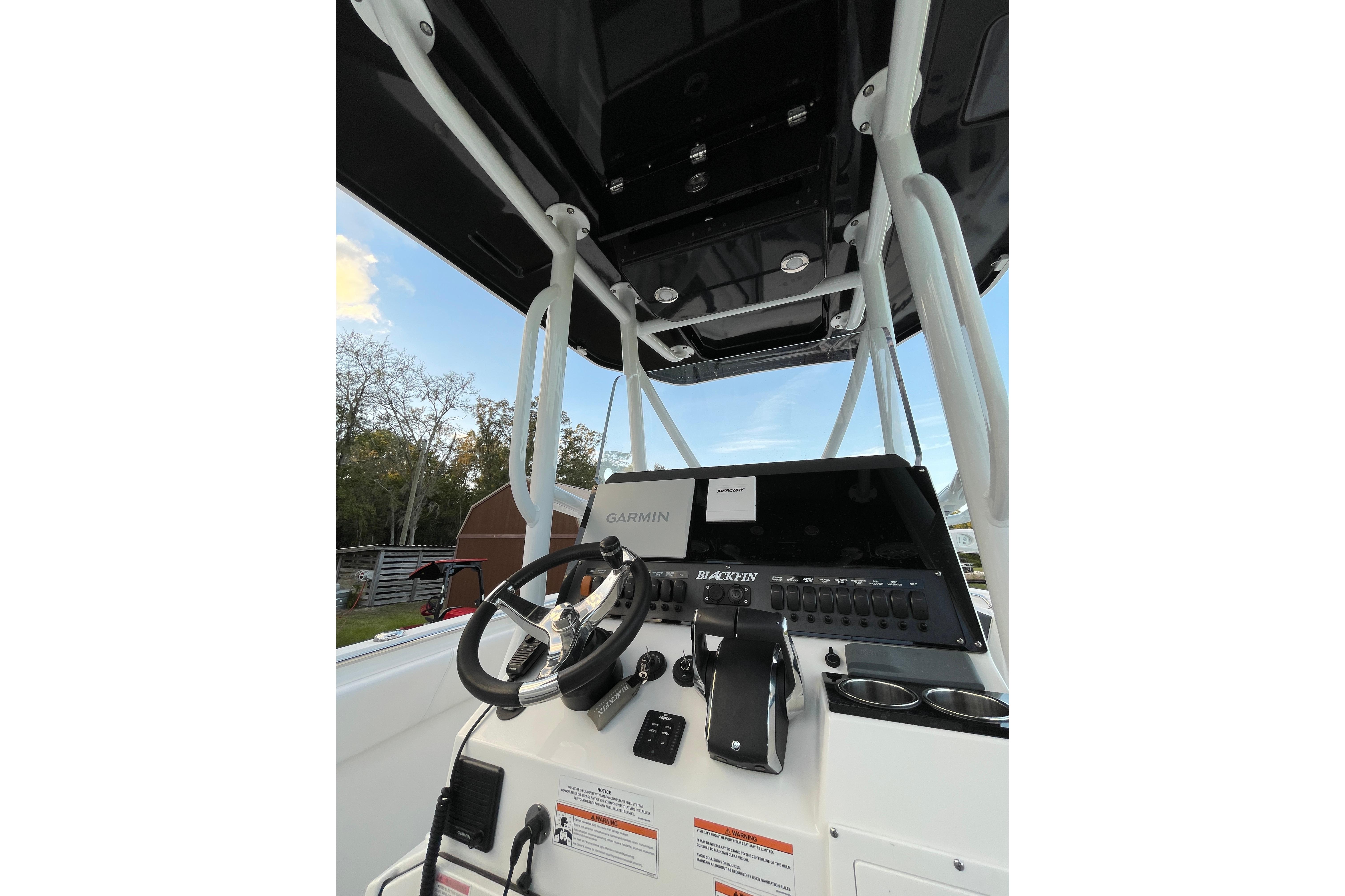 2022 Blackfin 252 CC boat console with Garmin navigation system and steering wheel.