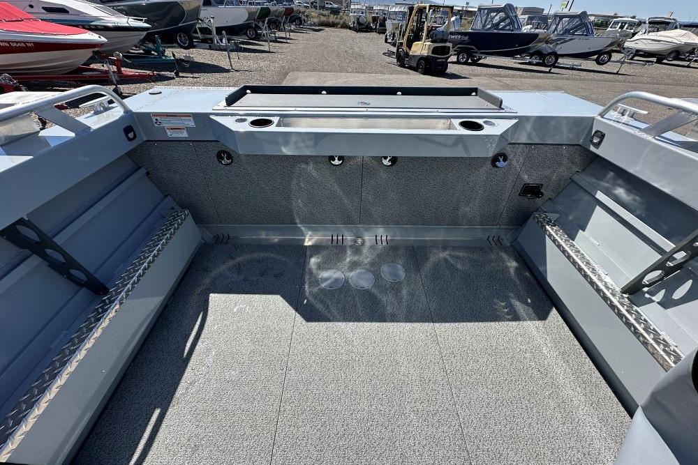 Interior view of 2026 Hewescraft 180 ProV ET boat, showcasing spacious deck and storage features.