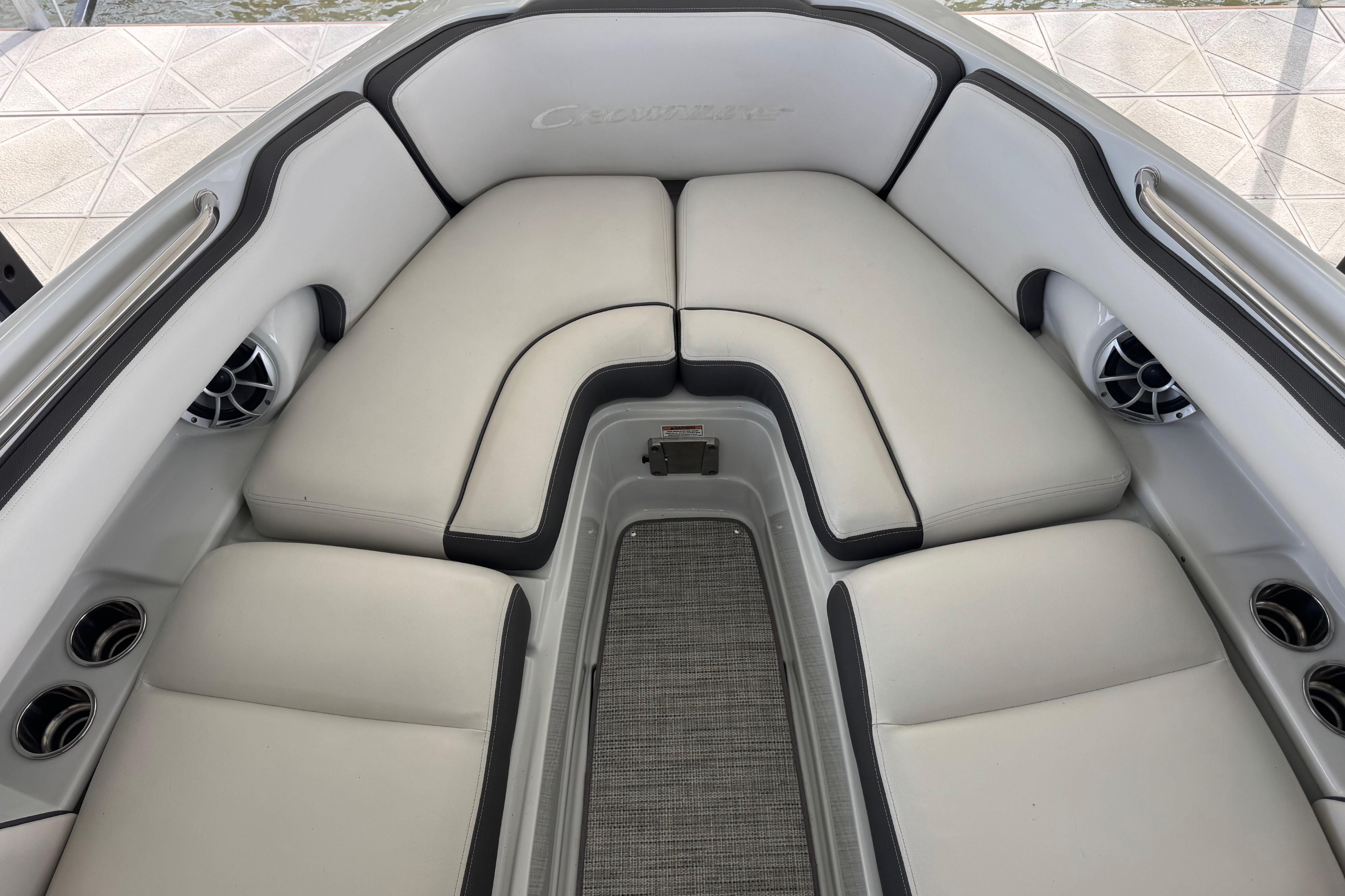 2022 Crownline 265 SS boat interior with plush seating and cup holders.