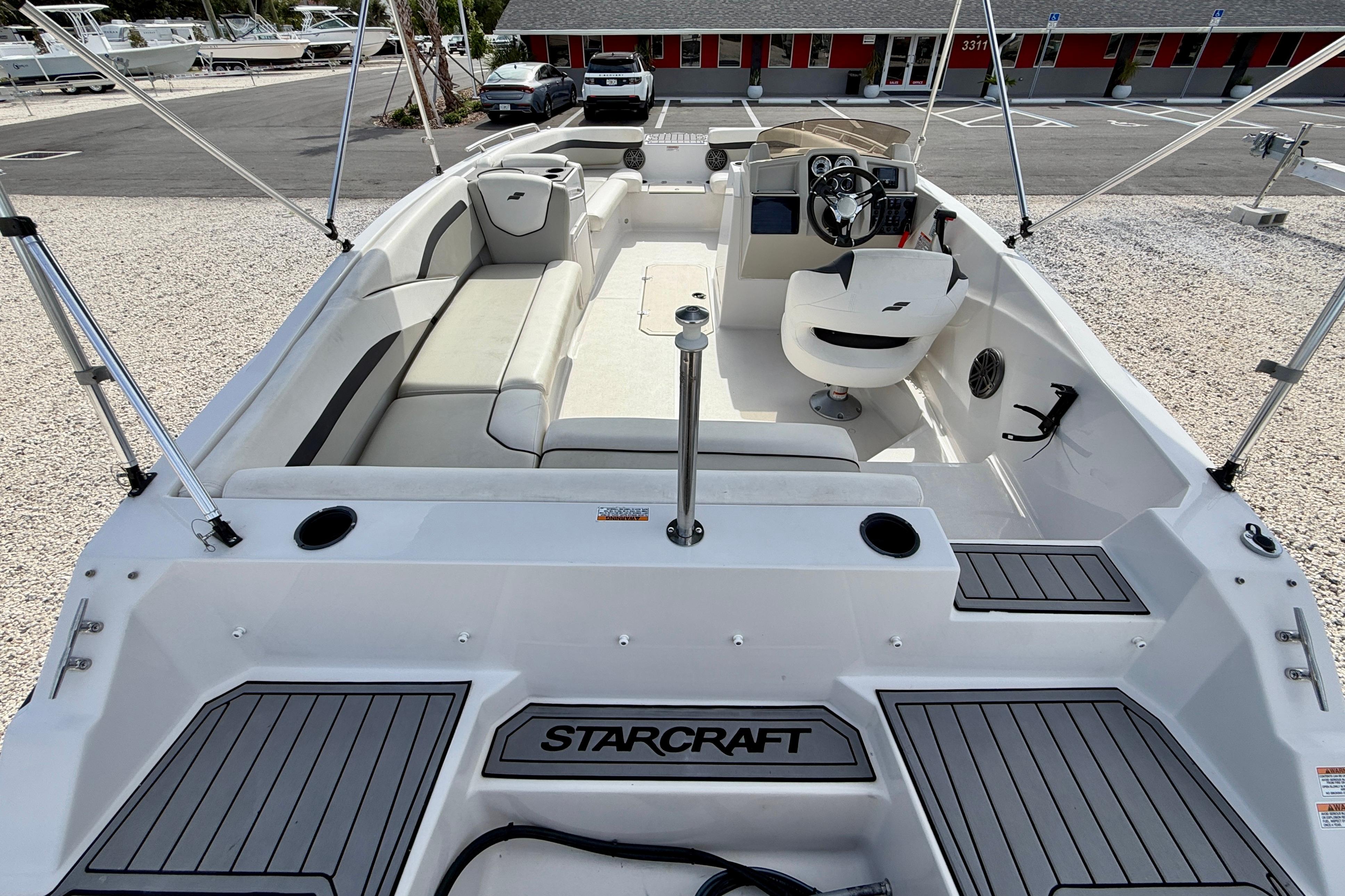 2021 Starcraft SVX 191 OB boat interior with seating and steering console.