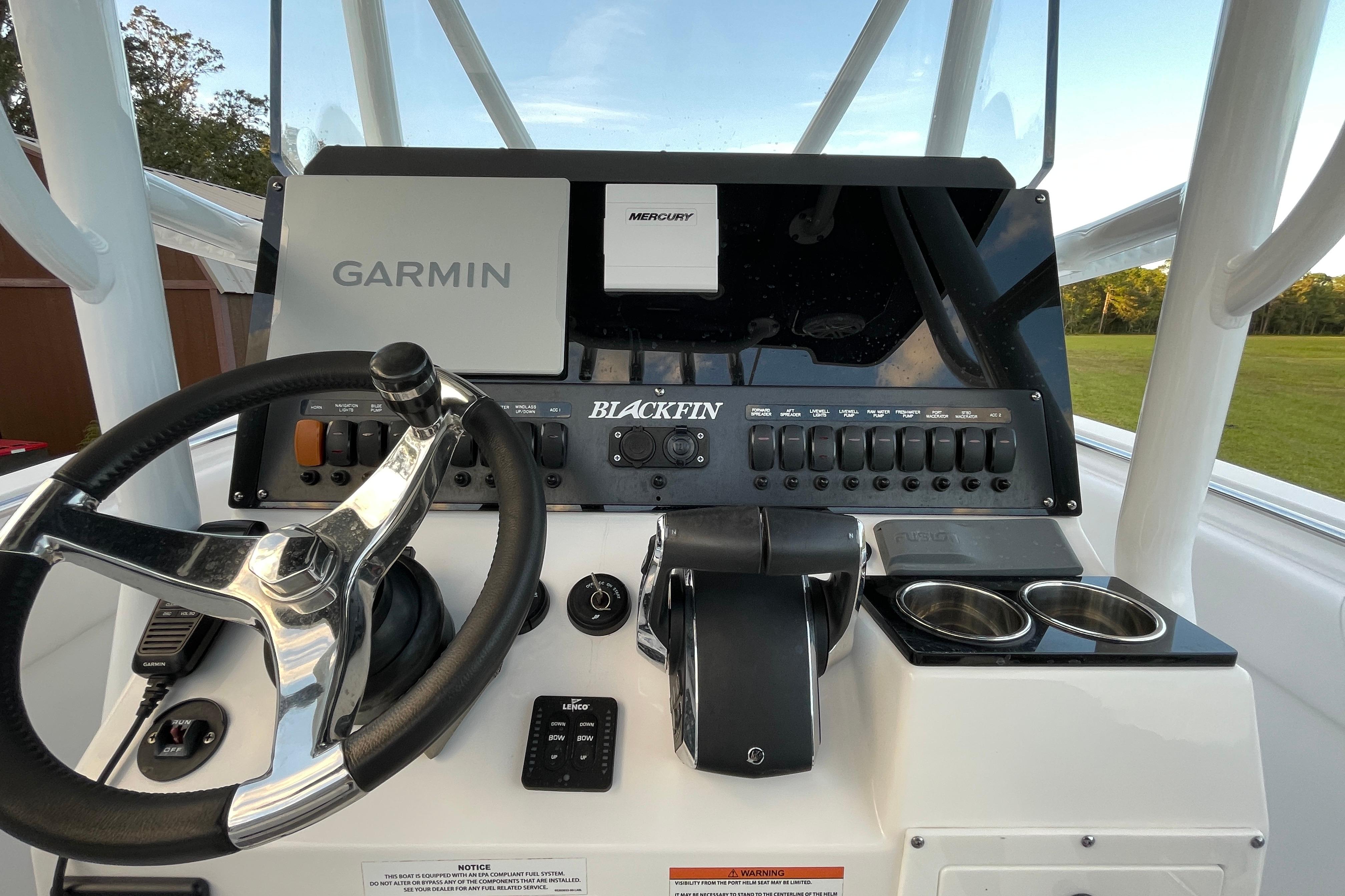 2022 Blackfin 252 CC boat dashboard with Garmin and Mercury controls.