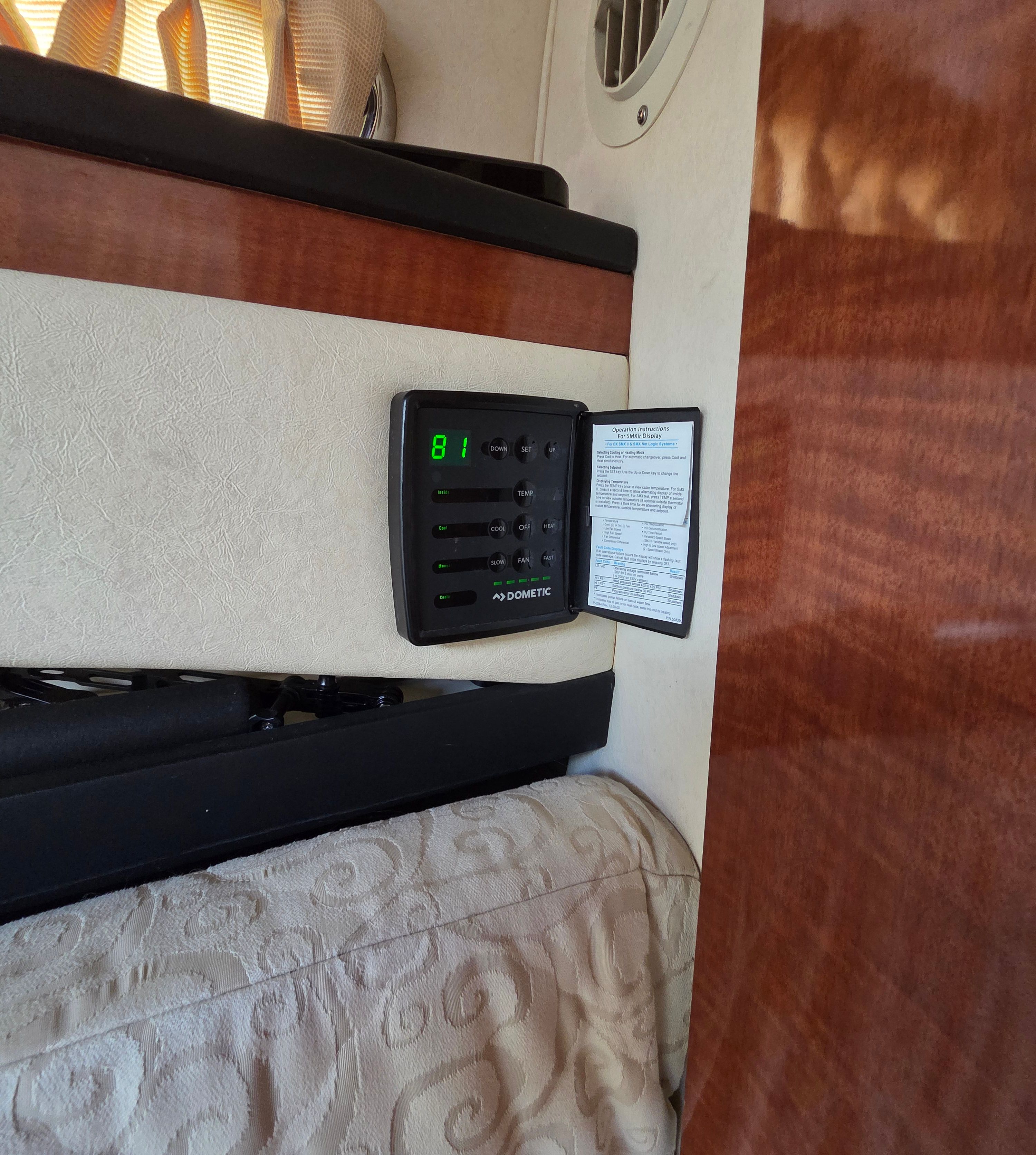 Interior of the Sea Ray Sundancer 260 with control panel and upholstery.