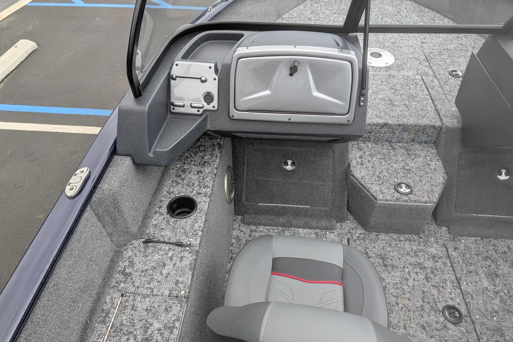 2026 Tracker Pro Guide V-175 WT boat interior with gray seating and storage compartments.
