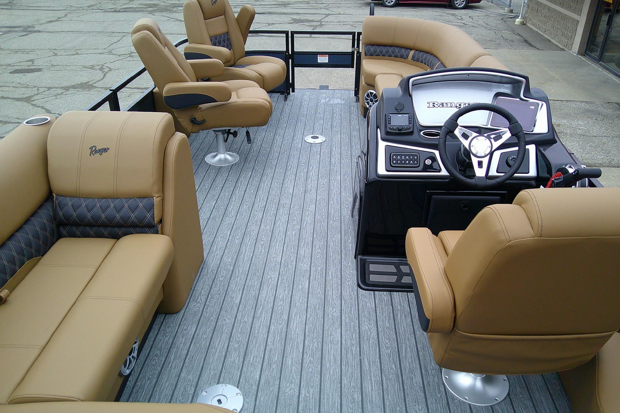 2026 Ranger 220FC boat interior with tan seating and modern steering console.