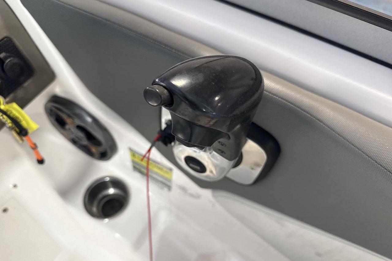 Close-up of throttle control in 2012 Regal 1900 Bowrider boat cockpit.