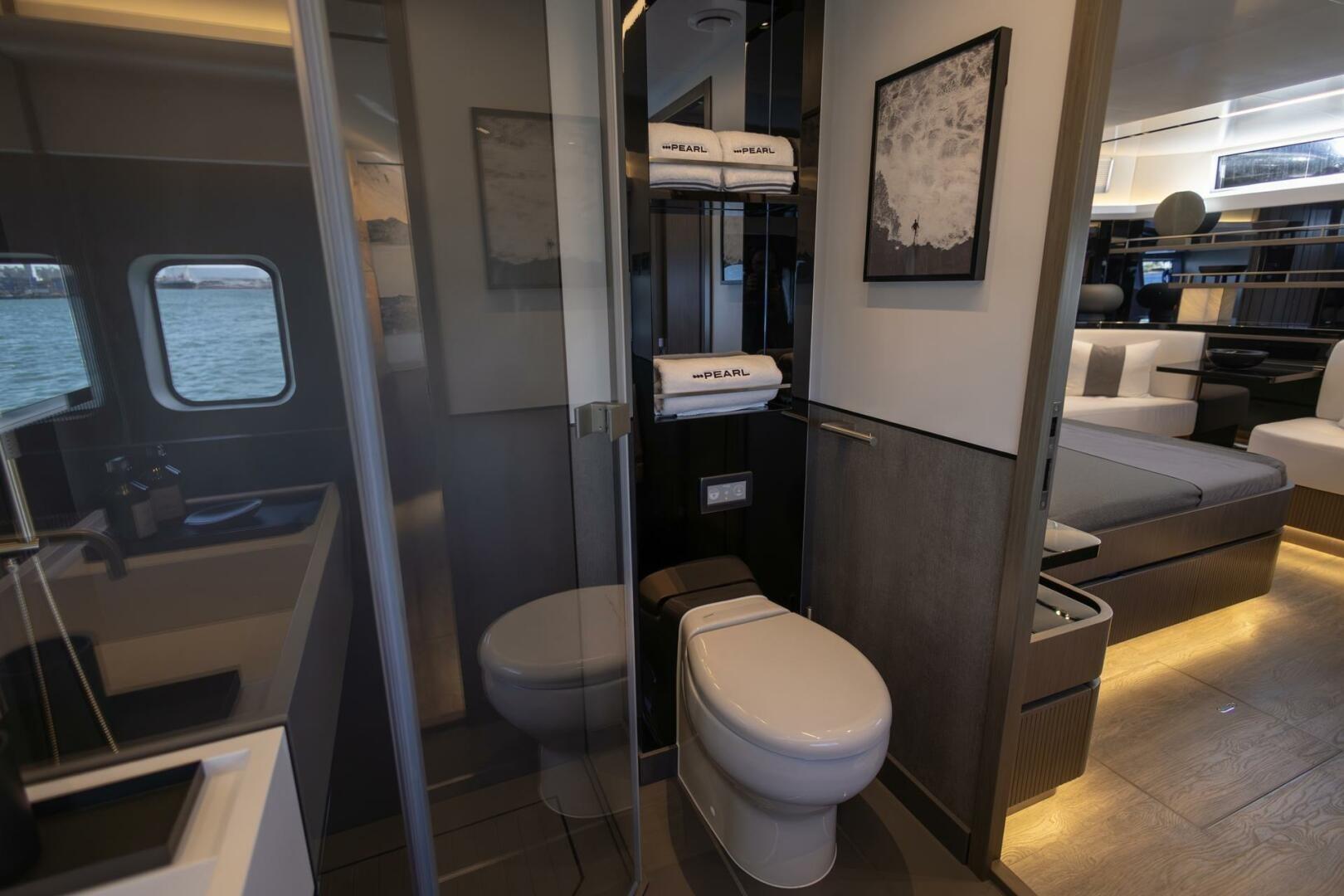 Luxurious bathroom interior of 2023 Pearl 72 yacht with modern amenities and ocean view.