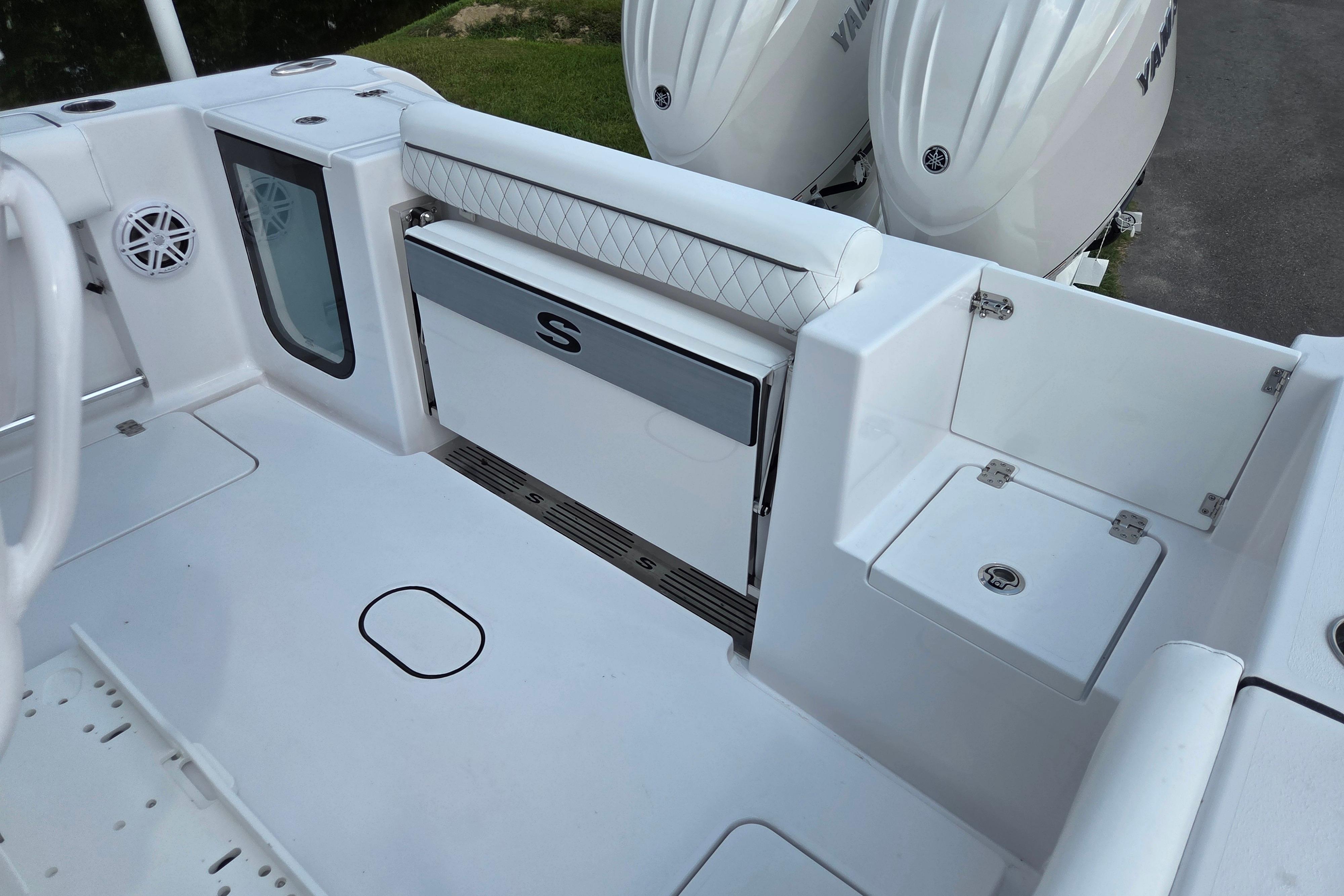 2026 Sportsman Open 252 Center Console boat interior with seating and storage compartments.