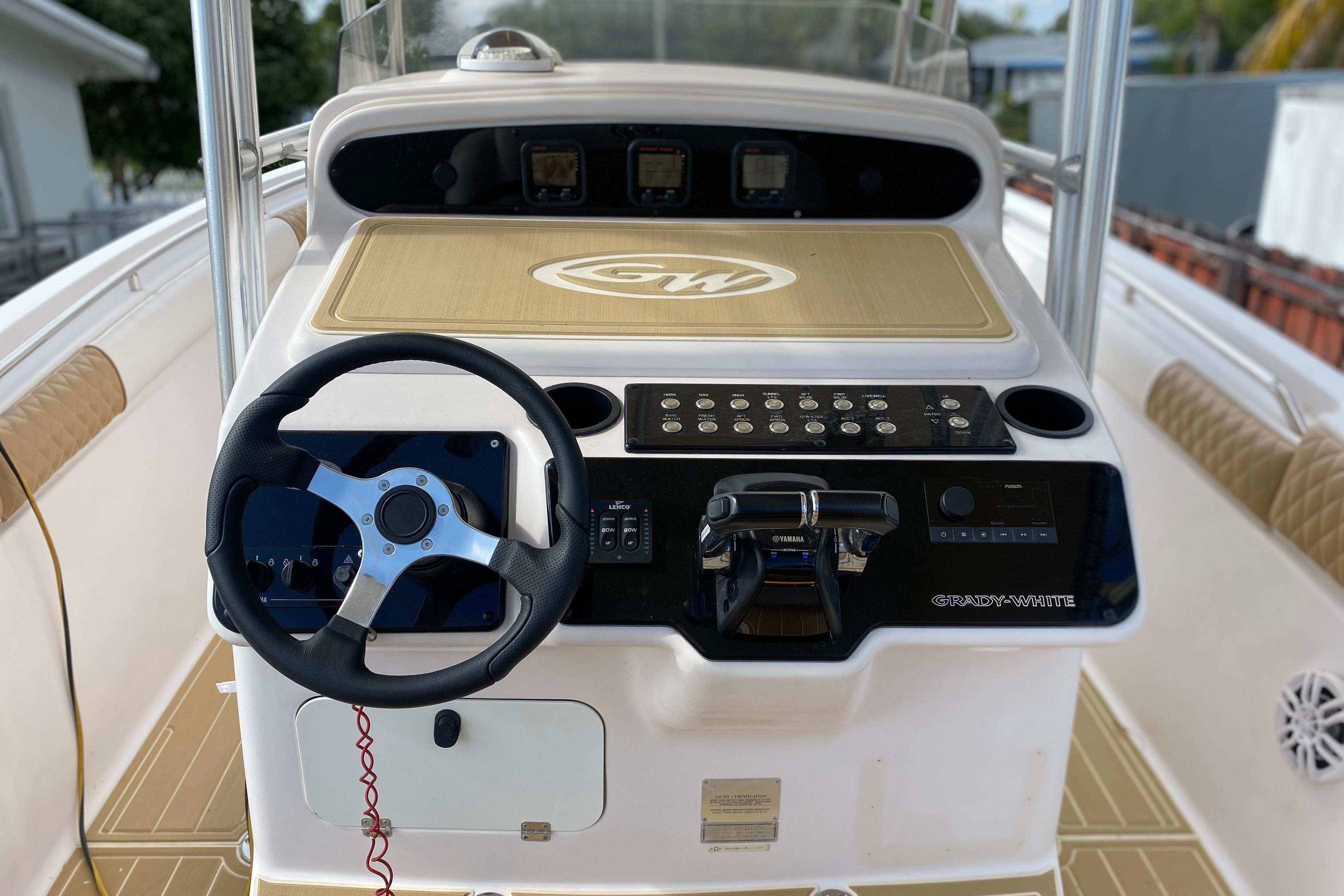 2004 Grady-White Canyon 283 boat console with steering wheel and control panel.