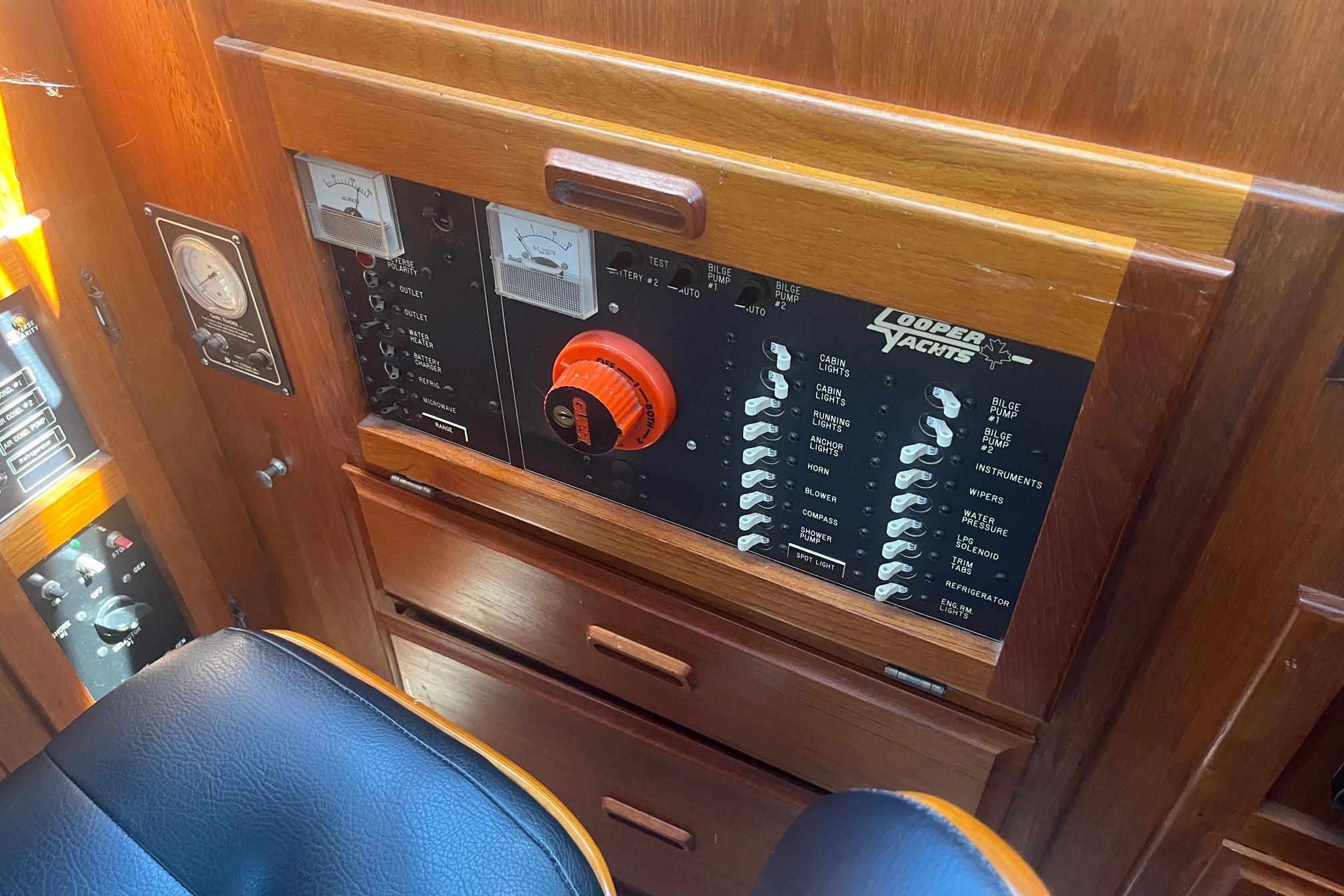 Control panel of a 1990 Cooper Prowler 35 yacht with switches and gauges.