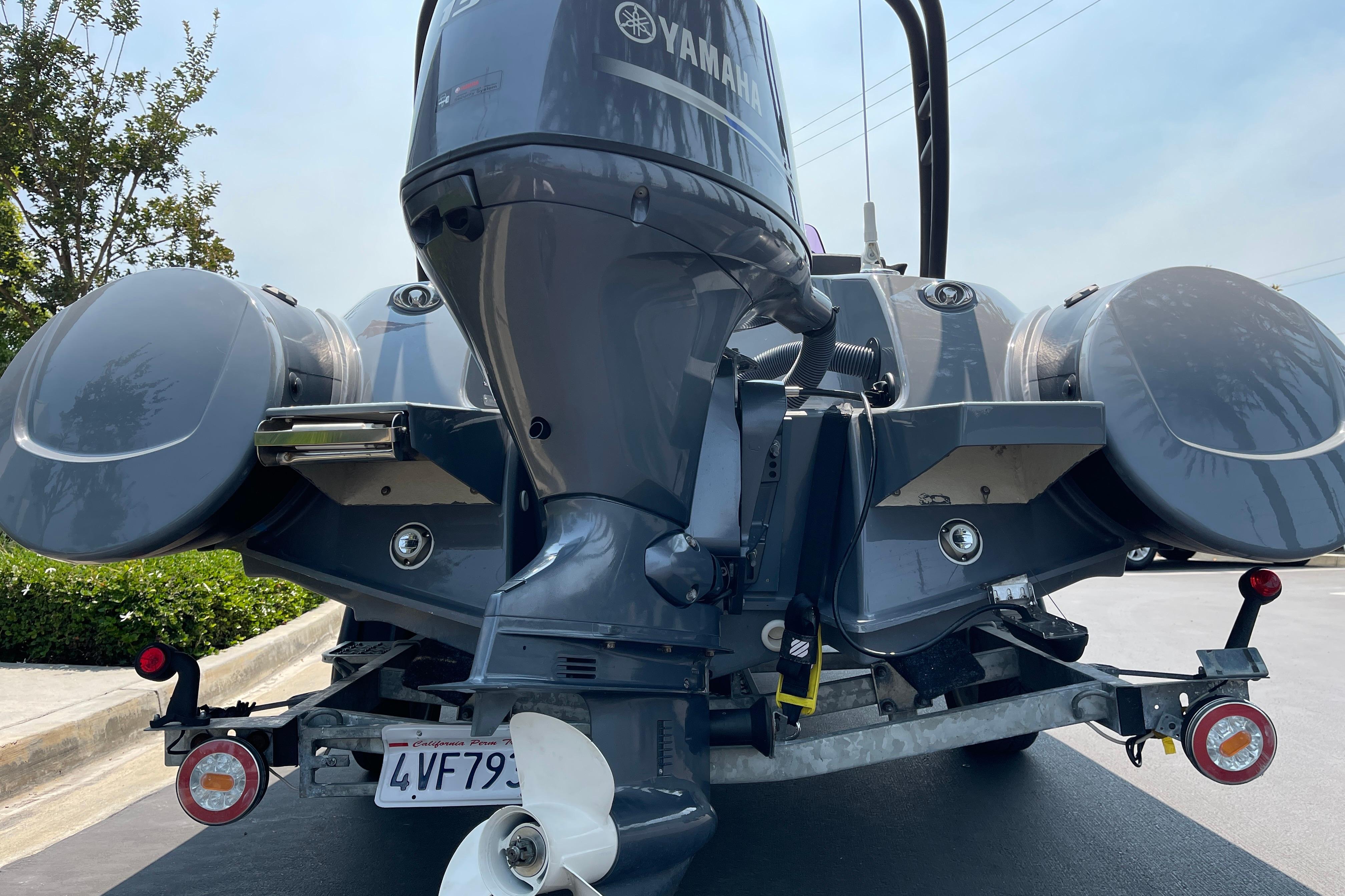 Rear view of a 2017 Grand Goldenline 500 boat with Yamaha outboard motor and Lumitex RGBW underwater lights.